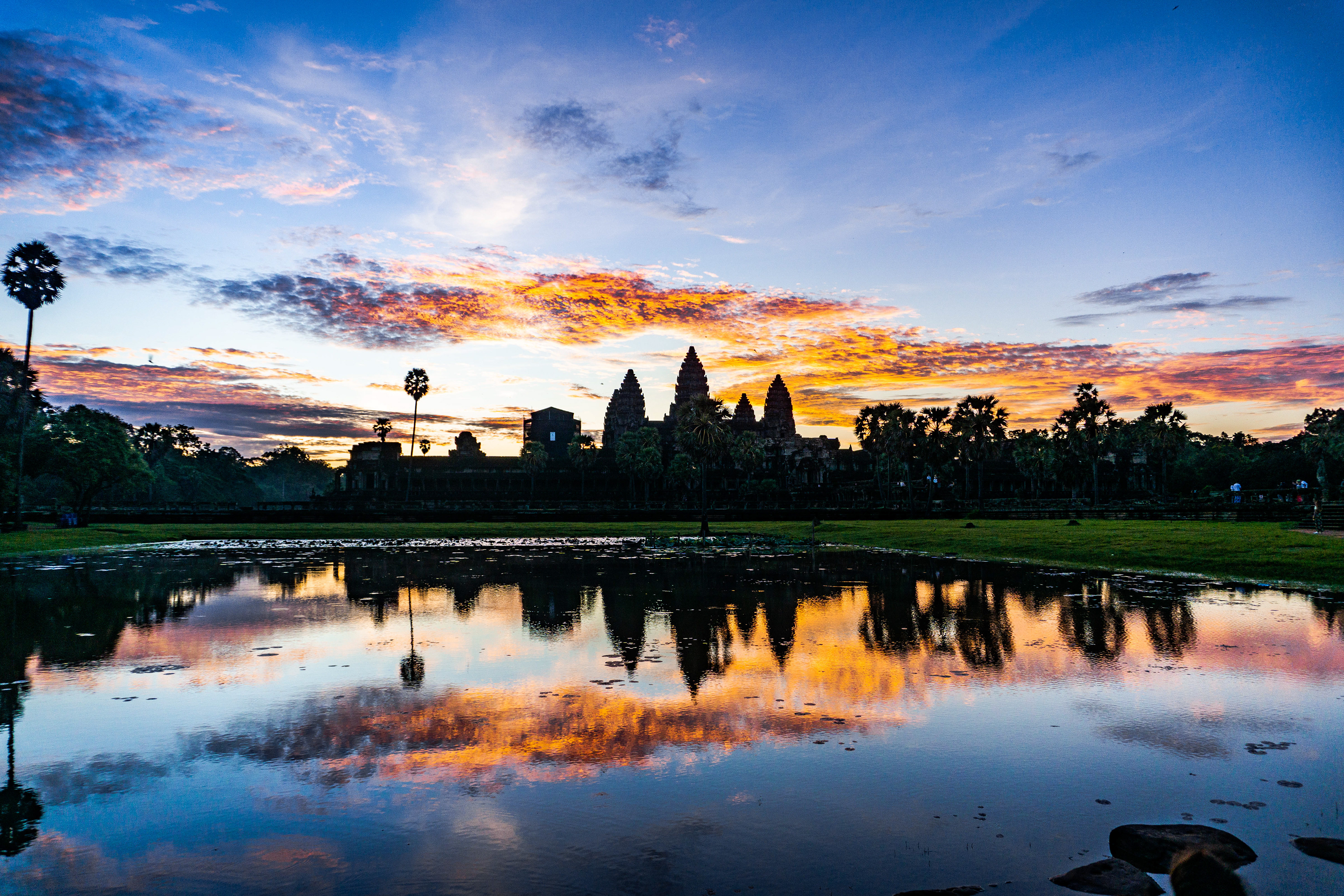 The Angkor Wat at sunrise reflecting in the ponds in front of the monastery