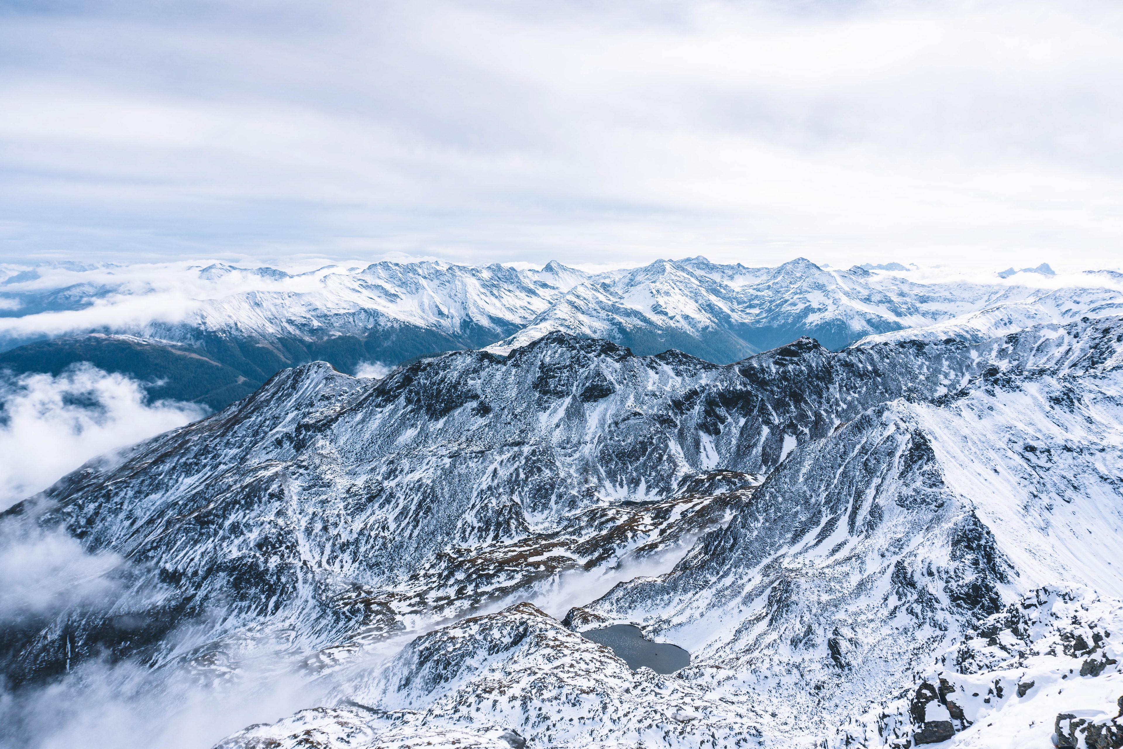 Snow covered mountain landscape photographed from the mountain peak Großer Zunig