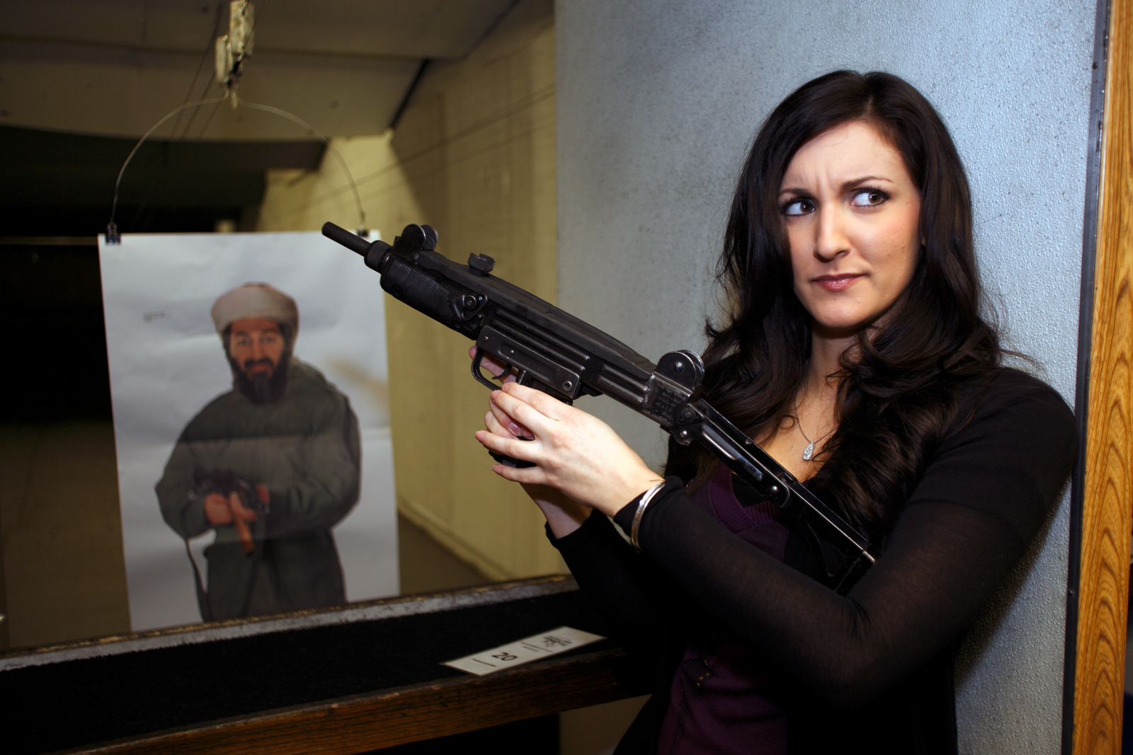 Girl with machine gun and Osama Bin Laden target, Las Vegas, Nevada, USA