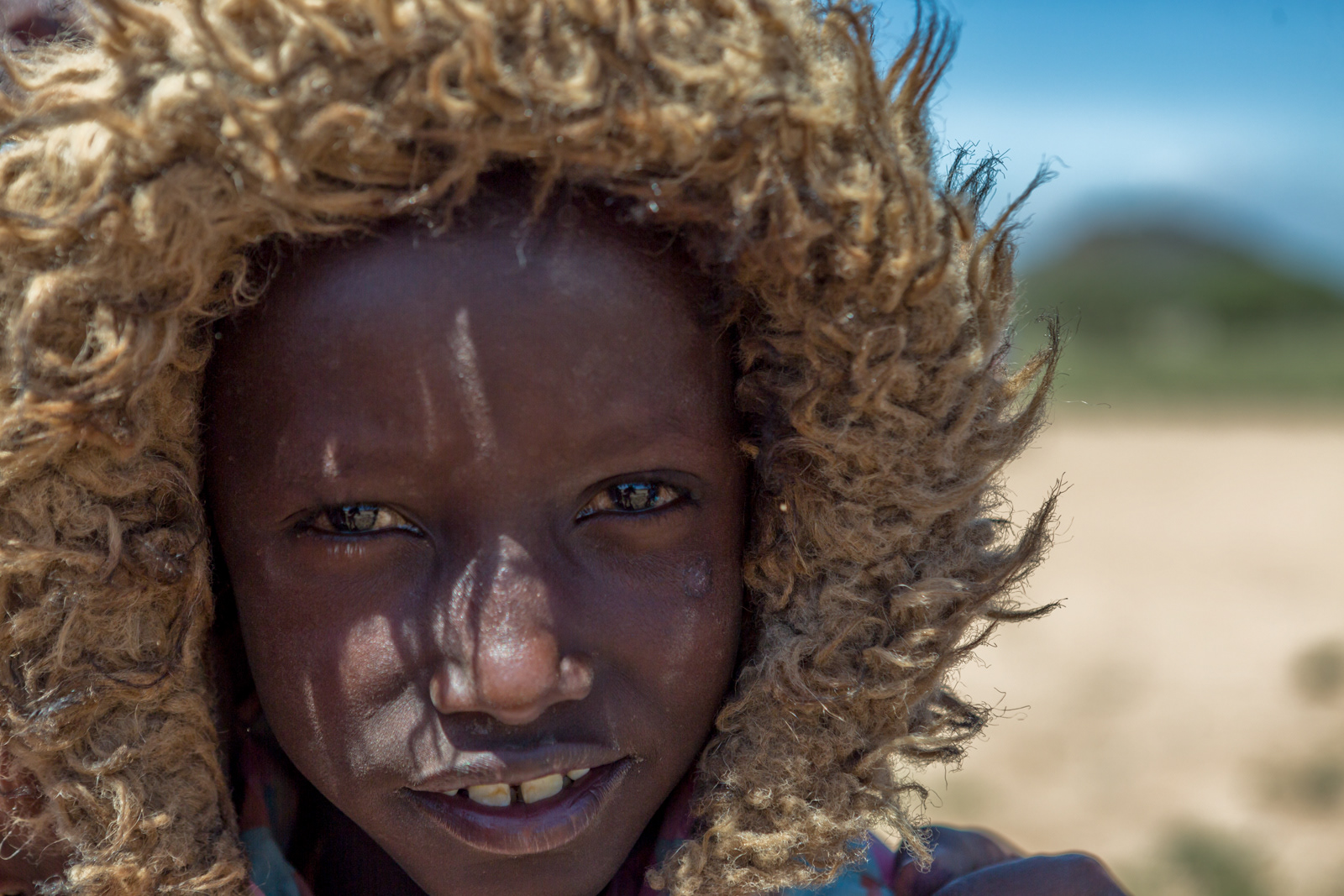 Boy wearing parka, Great Rift Valley, Kenya