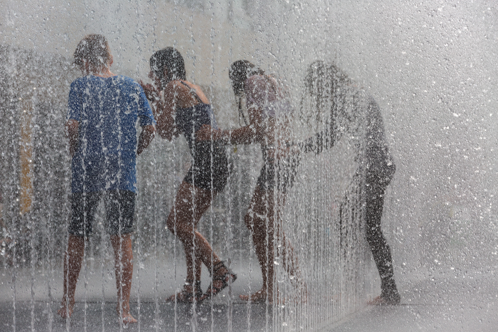Teenagers cooling off in fountain, Royal Festival Hall, London, England