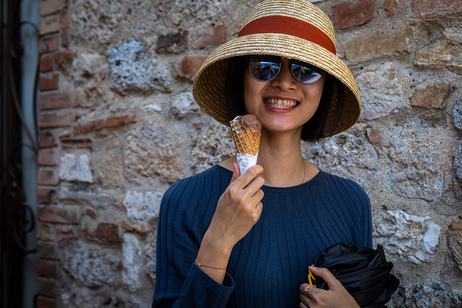 Smiley woman with ice cream, San Gimignano, Italy