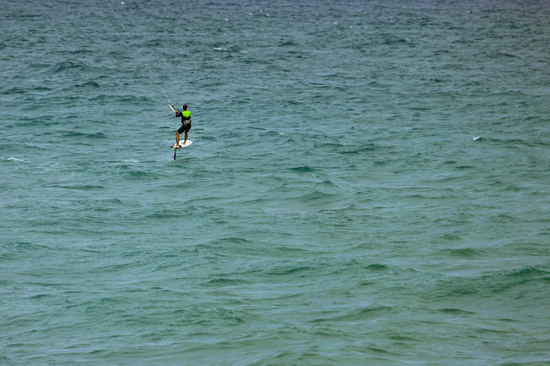 Kite surfing on a windy day offshore in Juno Beach Florida.