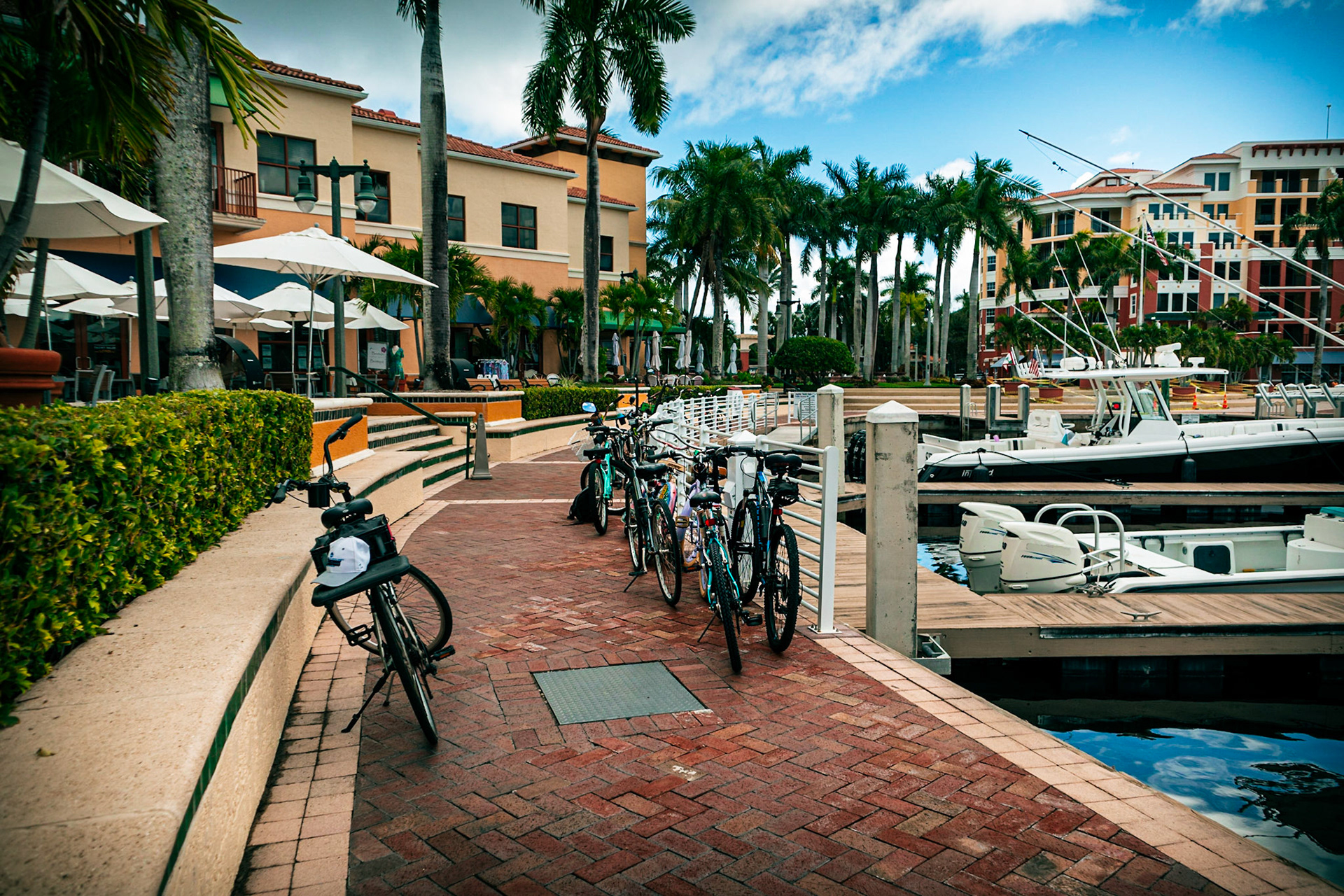 Bicycles leaning up against a railing in a marina in Riverwalk Florida, while on a pub crawl.