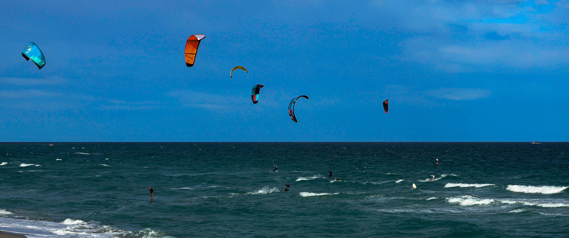 Kite surfing on a windy day offshore in Juno Beach Florida.