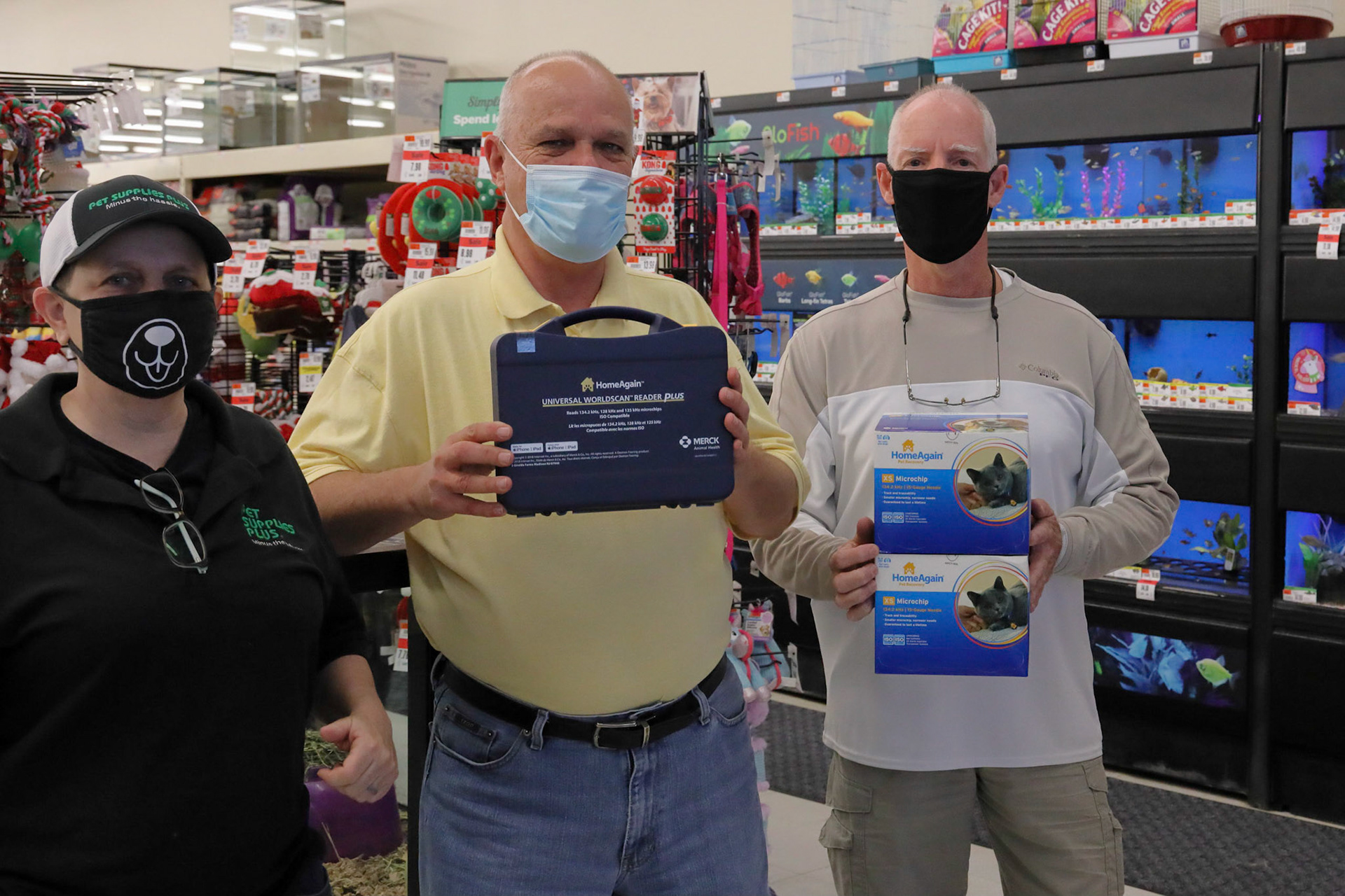 Donor and board members with new donated equipment