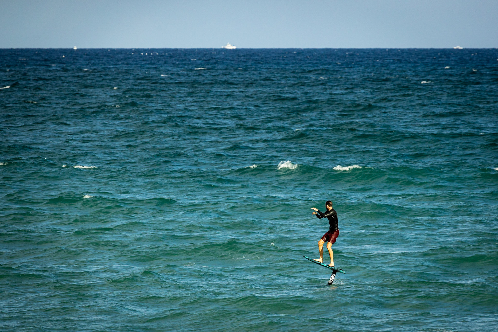 Catching some waves on a foil board in Florida.