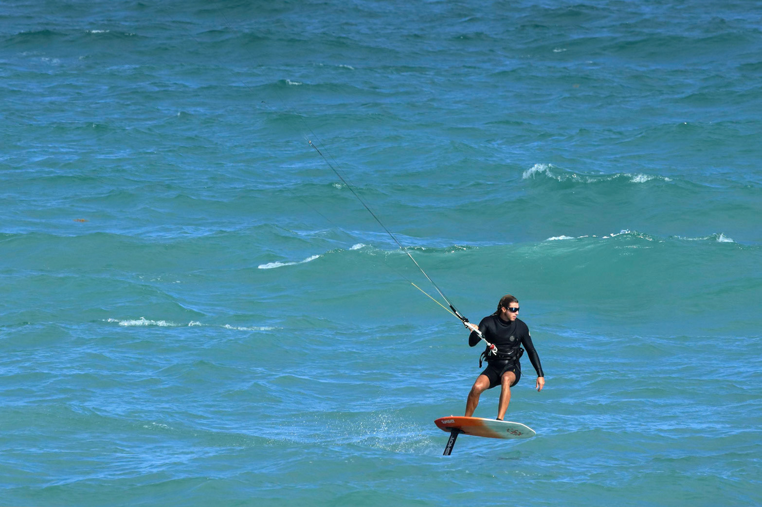 Kite surfing on a windy day offshore in Juno Beach Florida.