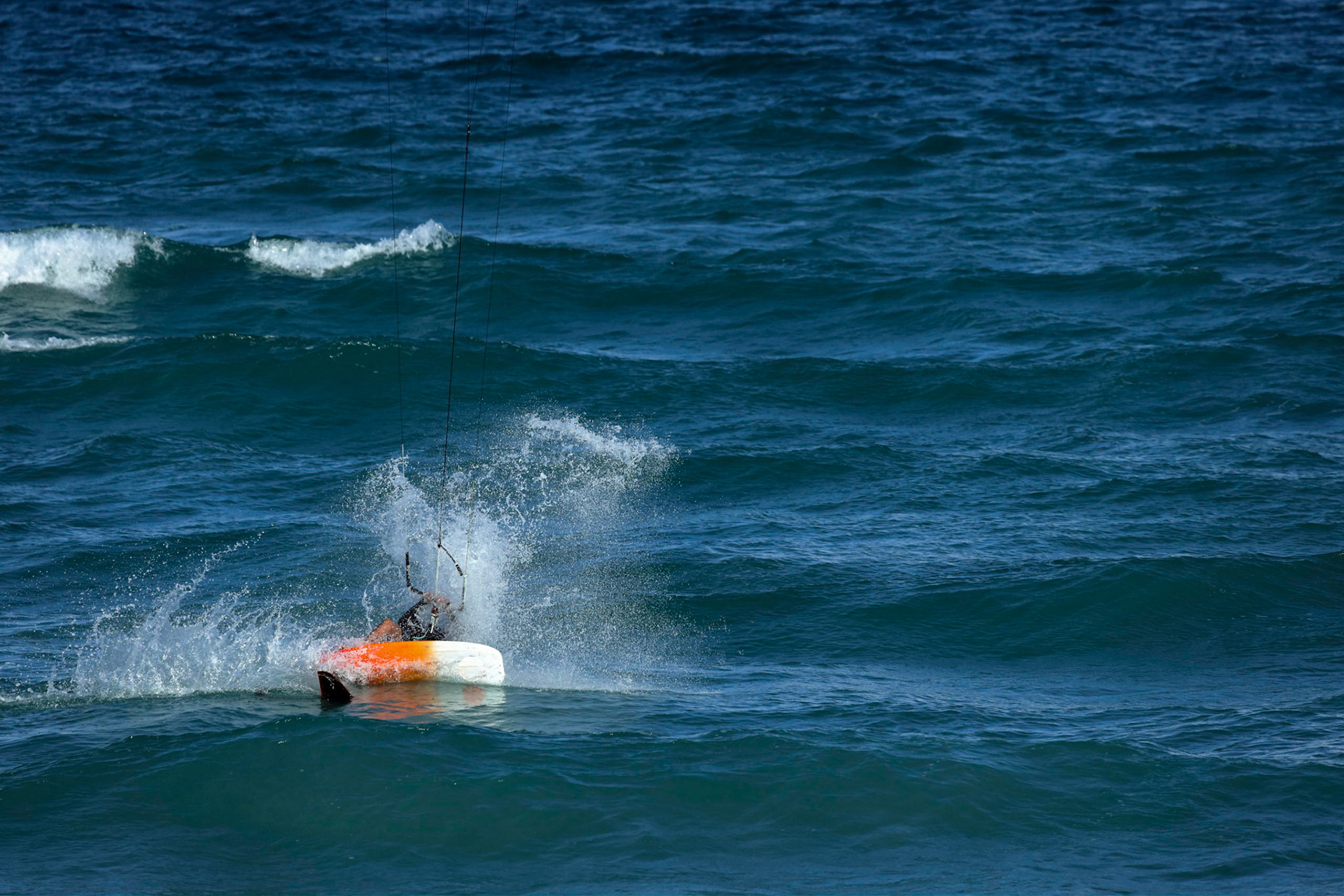 Kite surfing on a windy day offshore in Juno Beach Florida.