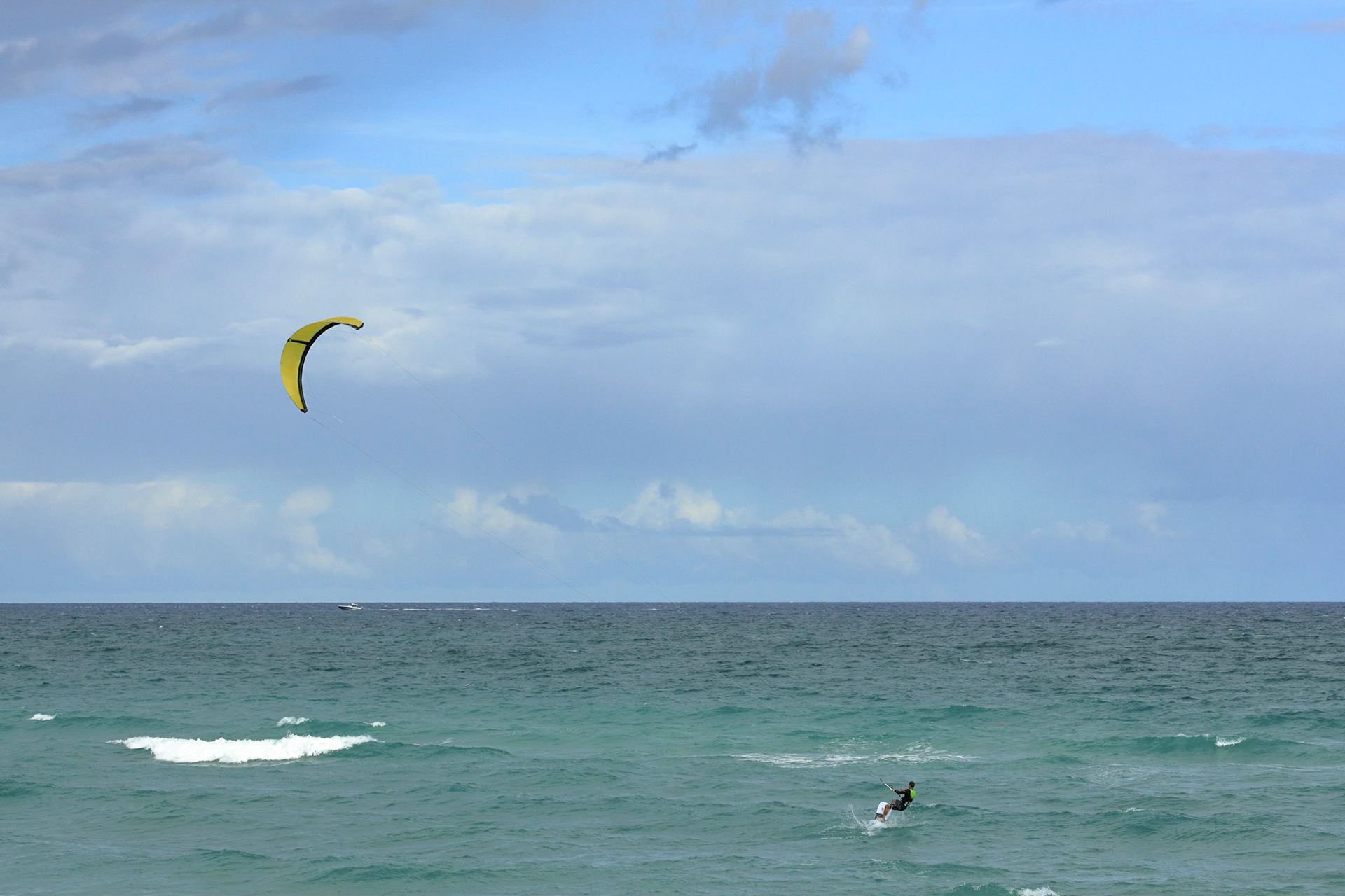 Kite surfing on a windy day offshore in Juno Beach Florida.