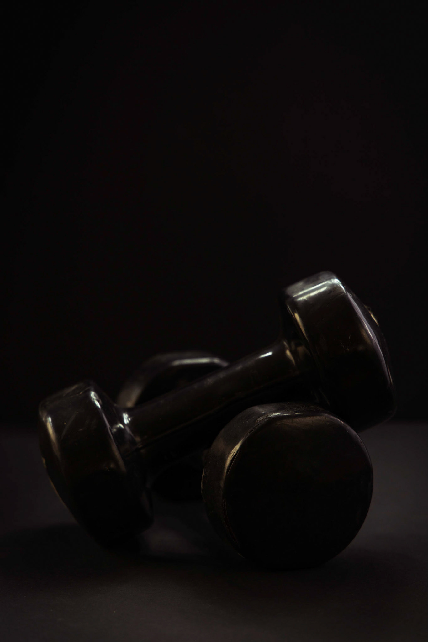 Dumb bells on a black backgraound