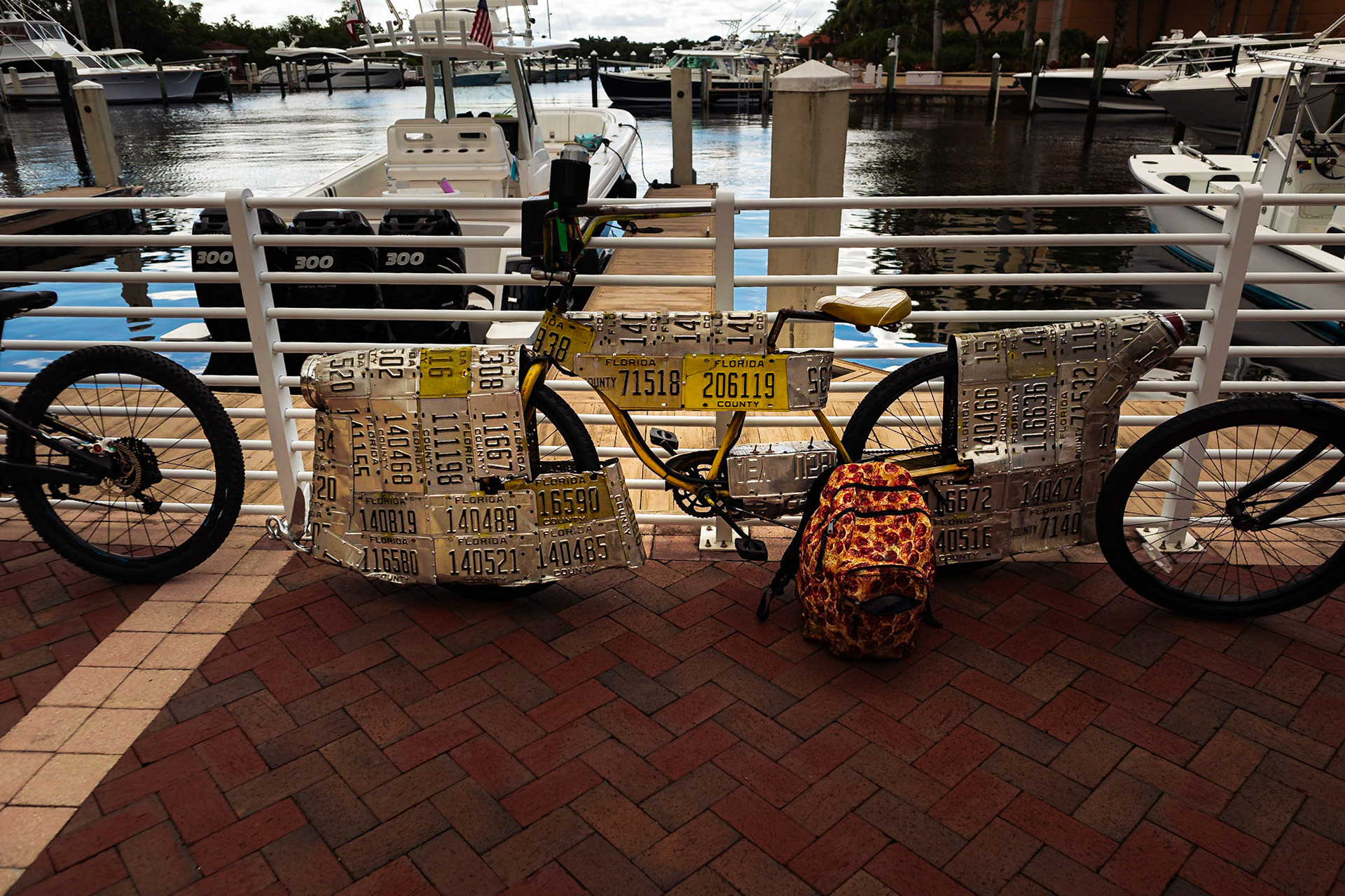 Bicycles leaning up against a railing in a marina in Riverwalk Florida.