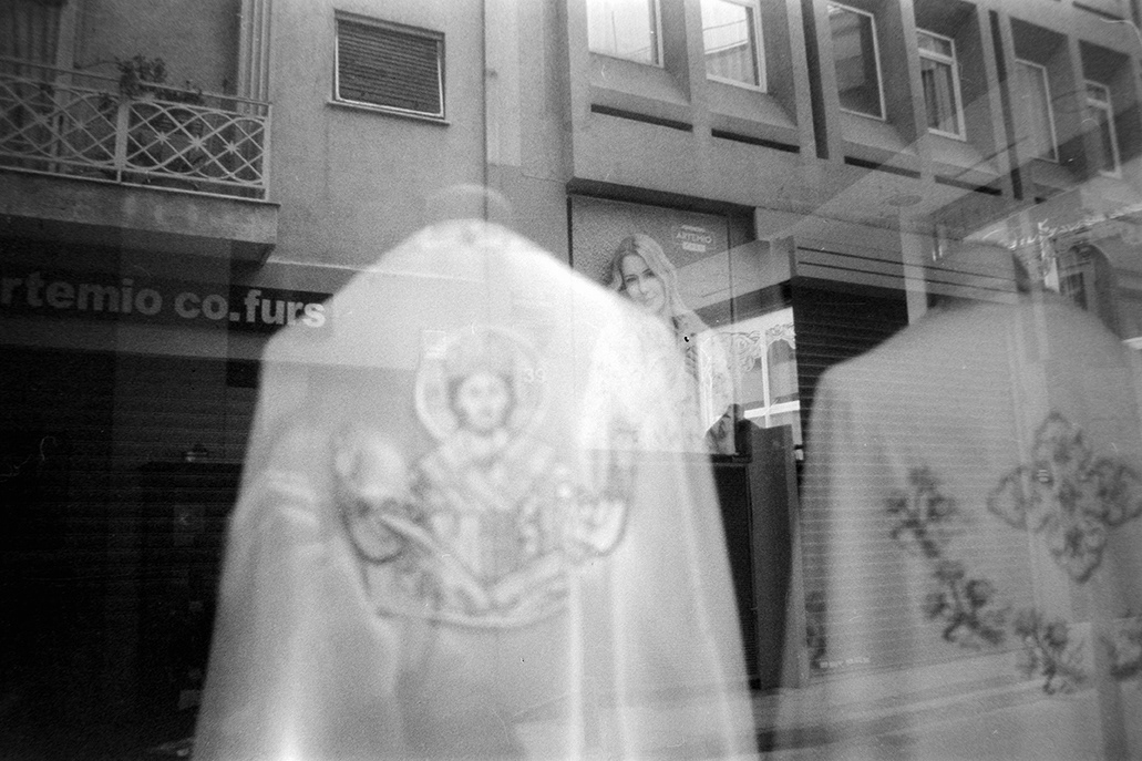 Strange little day,through a glass 1.Athens Feb.2023 With film Fomapan 400 b&w Nikon f301