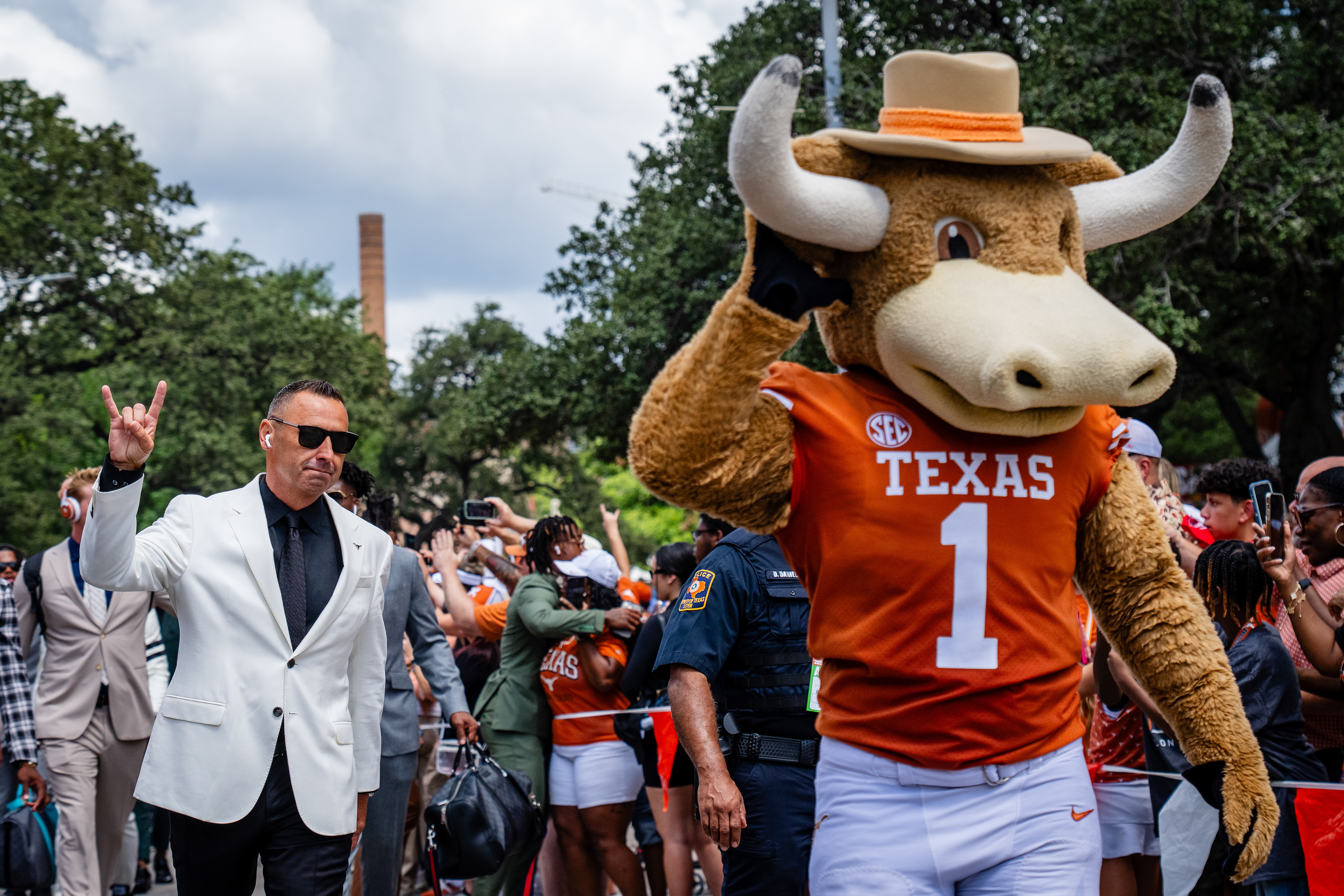 Head coach Steve Sarkisian of the Texas Longhorns and mascot Hook 'Em arrive at a game against the Colorado State Rams at Darrell K Royal-Texas Memorial Stadium in Austin, TX, Saturday, Aug. 31, 2024.