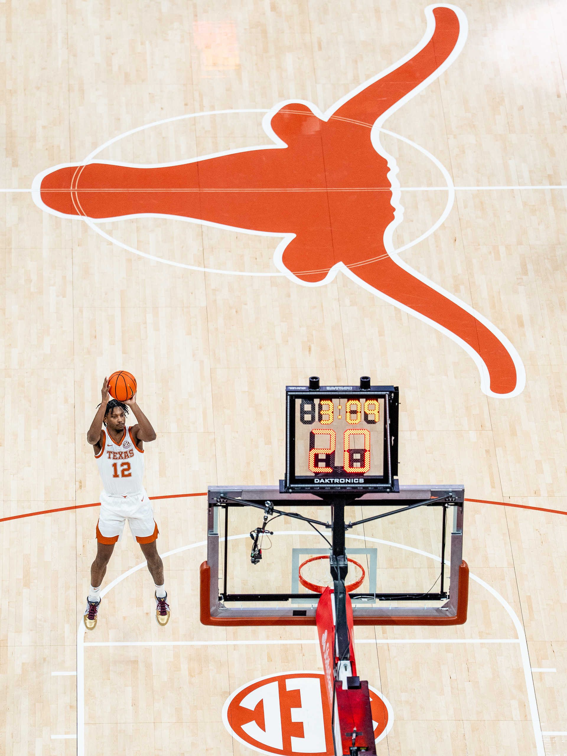 Texas guard Tramon Mark (12) attempts a warm up shot prior to a game versus New Mexico State at Moody Center in Austin, TX., Thursday, Dec. 12, 2024.