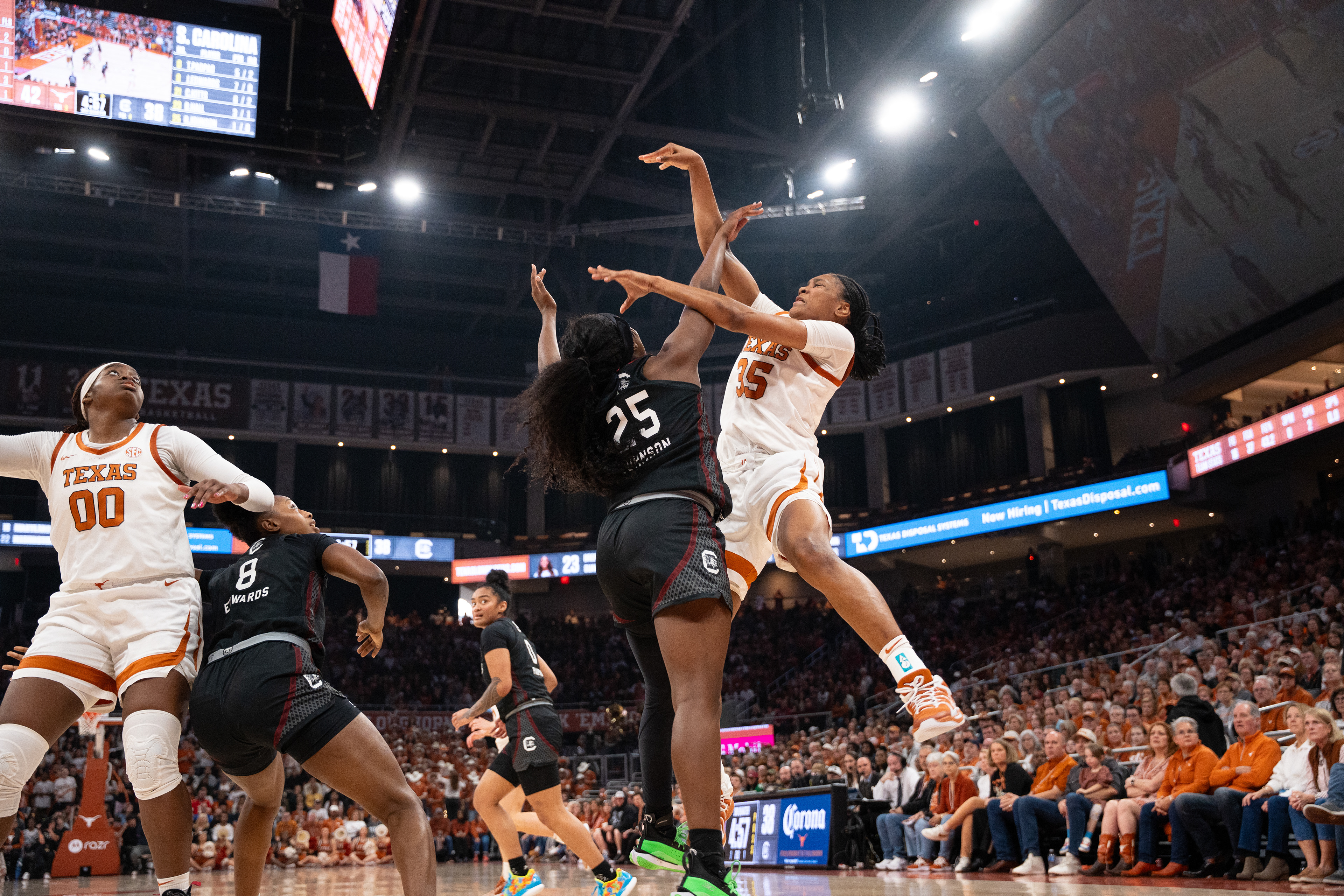 Texas guard Madison Booker (35) shoots a contested jumpshot over South Carolina guard Raven Johnson  (25) in the third quarter of a game at Moody Center in Austin, TX., Sunday, Feb. 16, 2025.