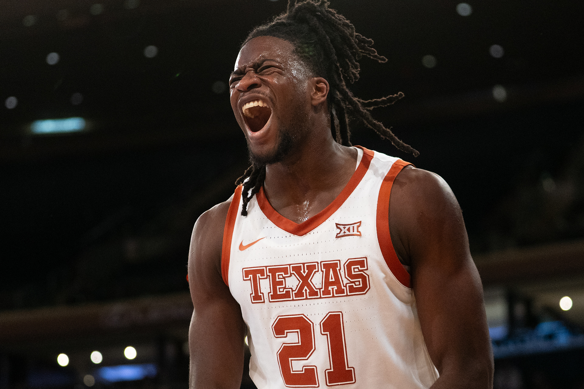 Texas center Ze'Rik Onyema (21) celebrates after a dunk against UCONN at Madison Square Garden in New York, N.Y., Monday, Nov. 20, 2023.
