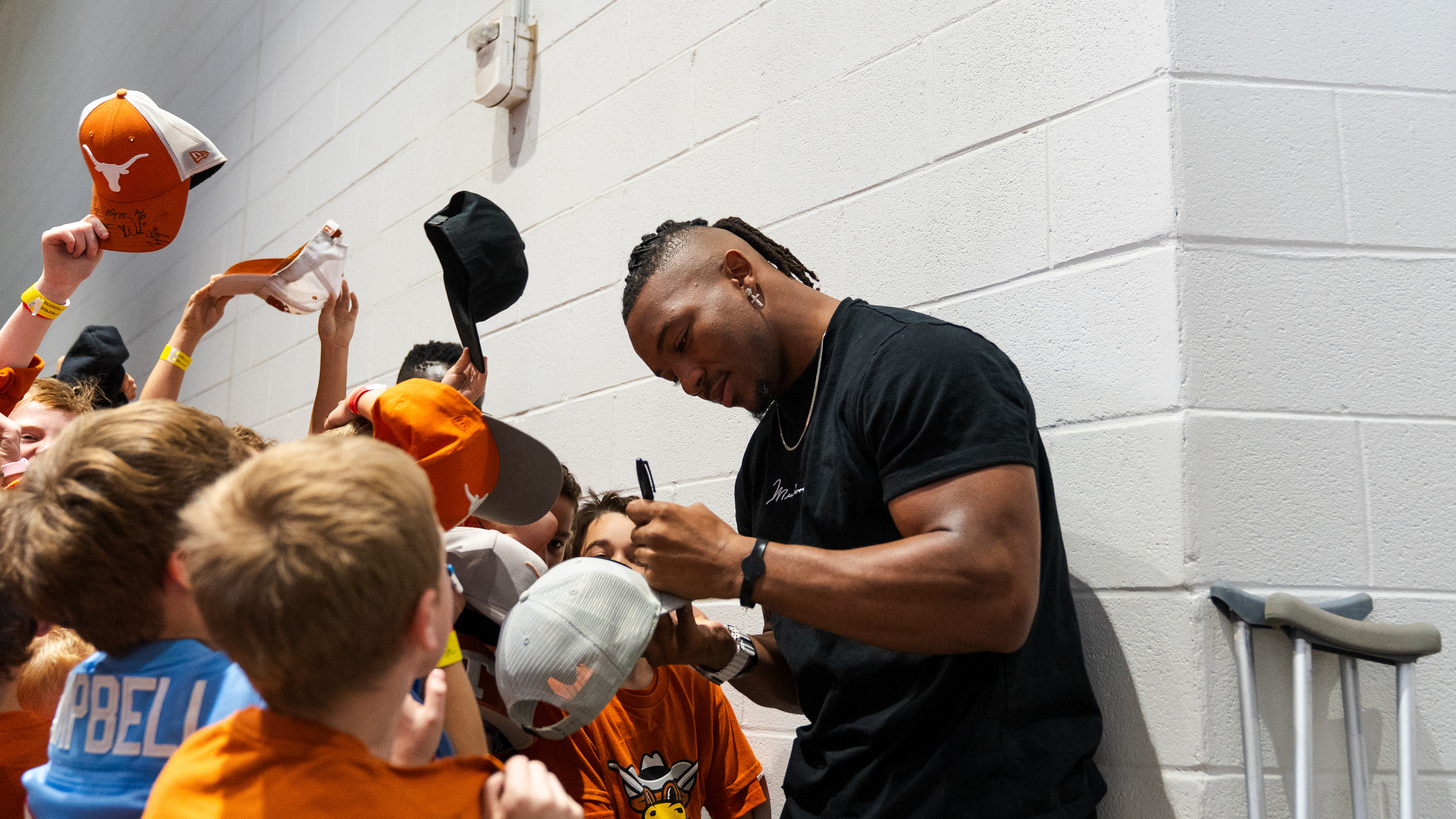 Atlanta Falcons running back Bijan Robinson signs autographs for young fans ahead of the Texas Football Orange-White Spring Game at Darrell K Royal-Texas Memorial Stadium in Austin, TX., Saturday, Apr. 20, 2024.