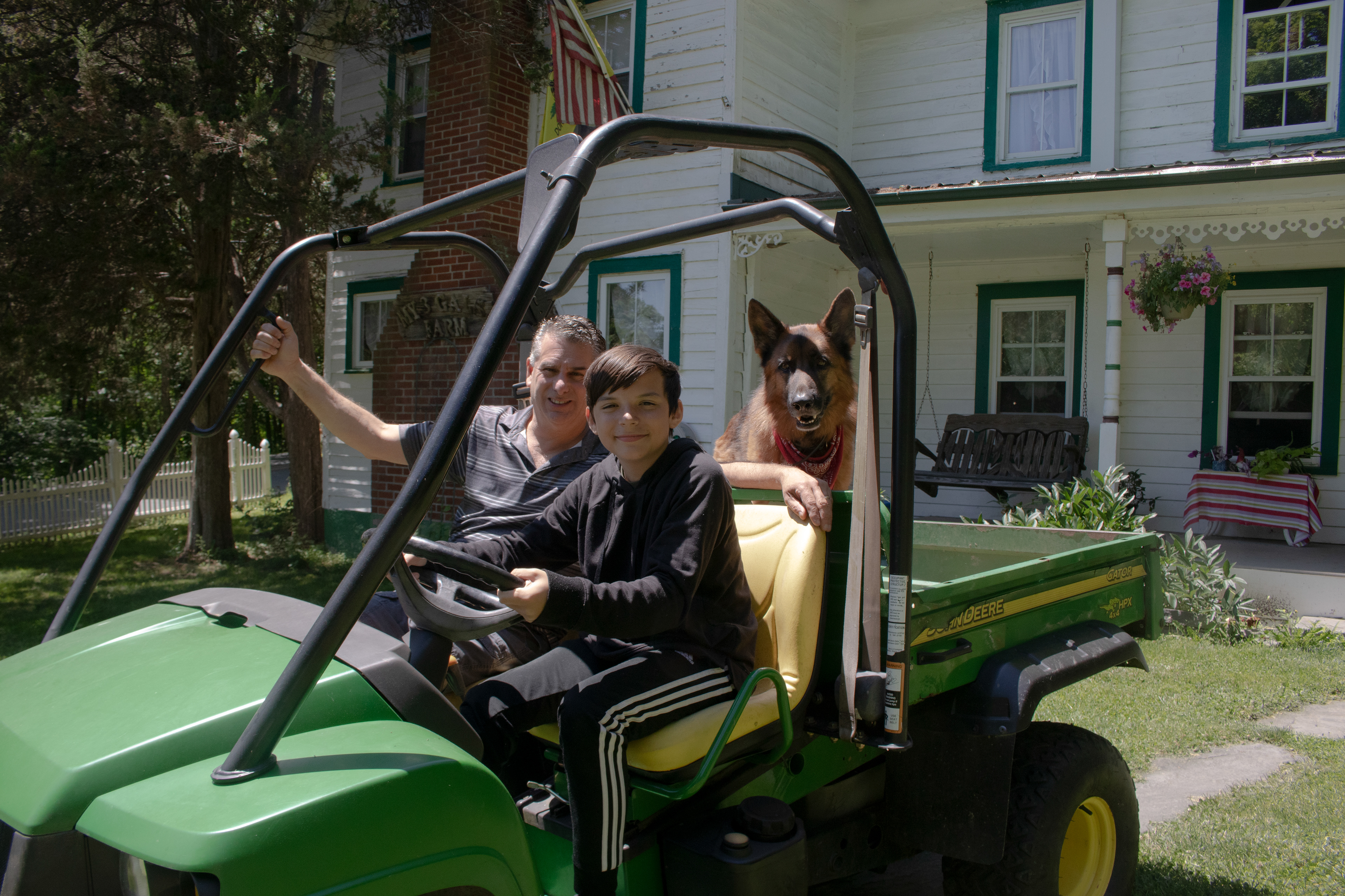 James driving the gator with Dad and Brody. 