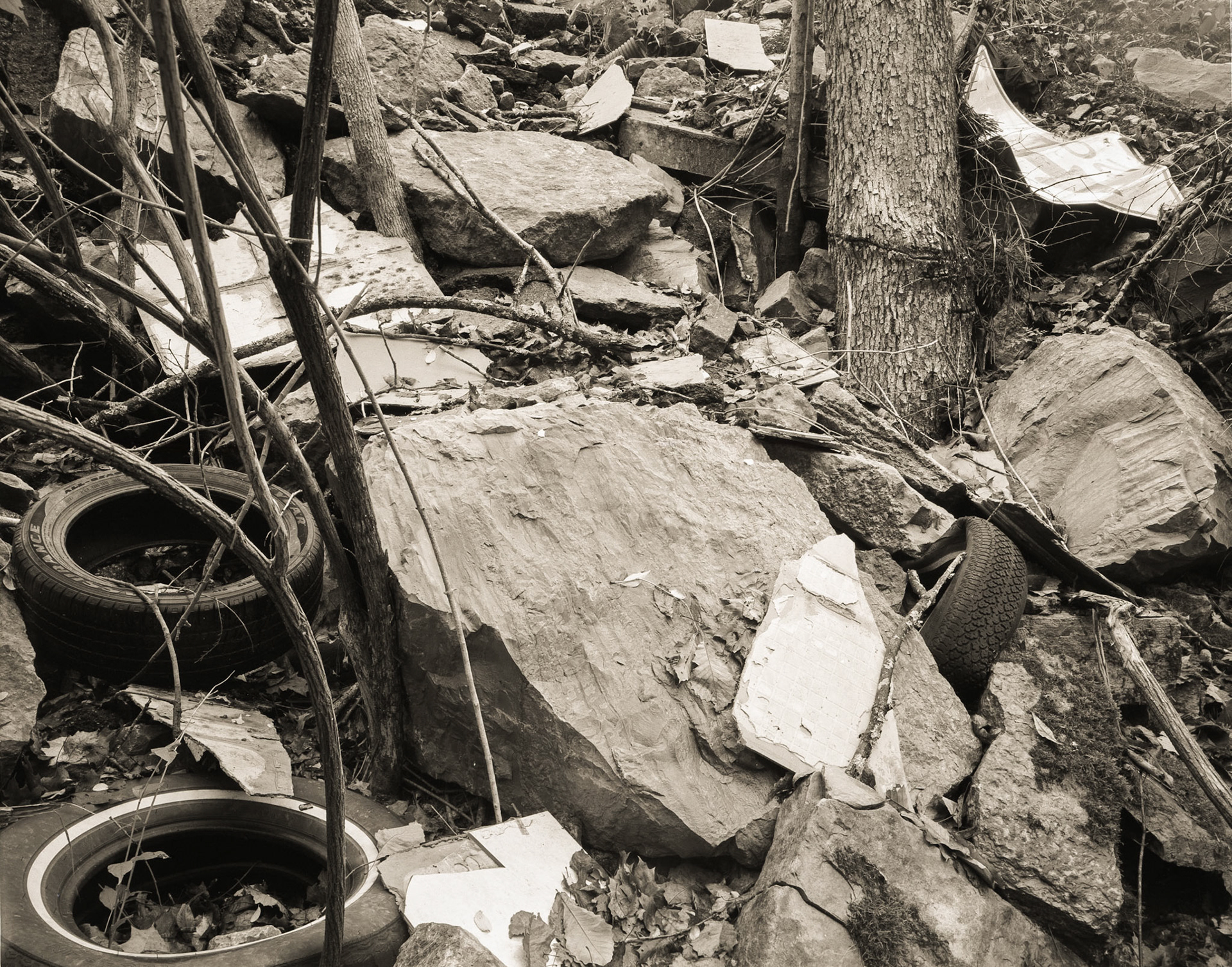 A Mess: Tires, Rocks, Sign