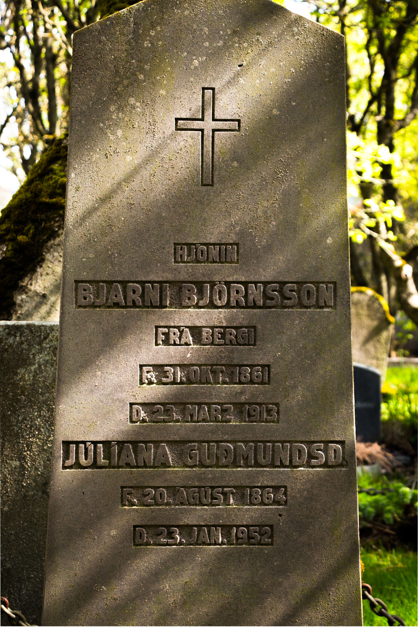Tombstone with shadows, Hólavallagarður Cemetery. Reykjavik, Iceland. 2018