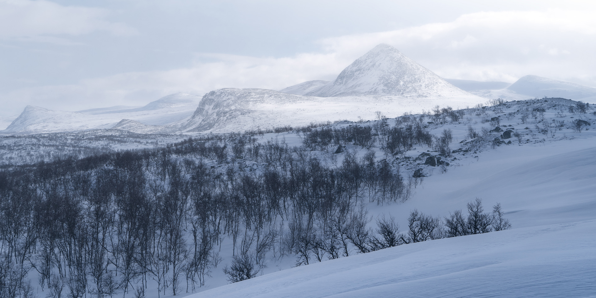 Slugga Mountain in a hazy winter landscape scene, Swedish Arctic, Sarek / Suorva / Storja Sjofallet / Laponia