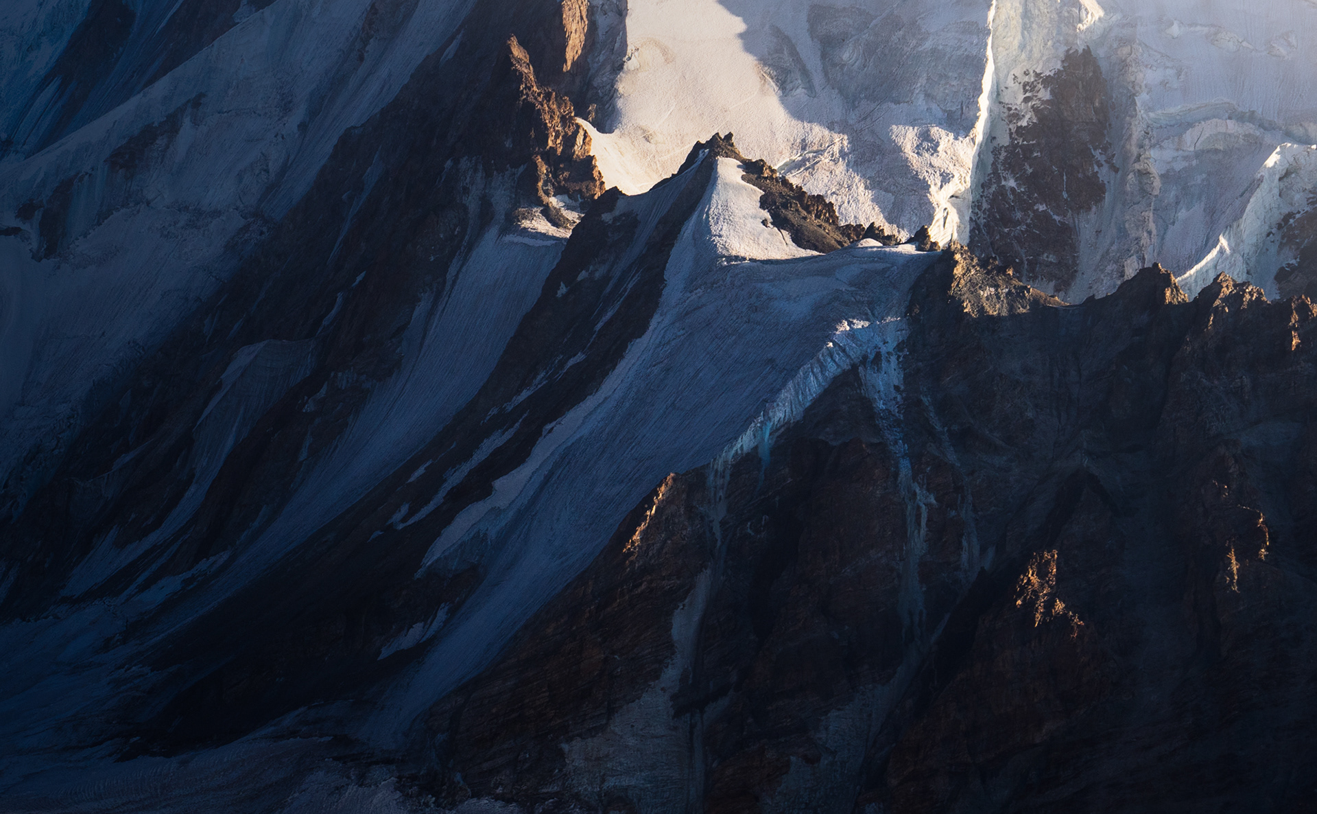 A zoom in photo of a glaciated peak.