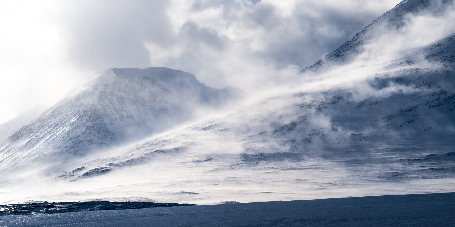 Mountains in the middle of Sarek National Park in a winter storm with strong winds and whiteout conditions. Sarek National Park, Swedish Arctic
