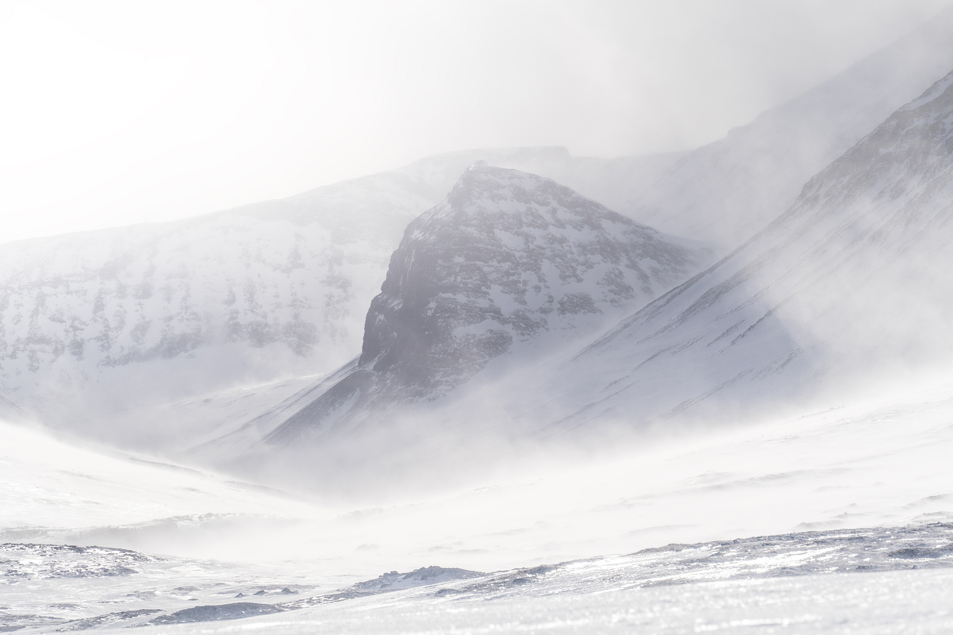 Mountains in the middle of Sarek National Park in a winter storm with strong winds and whiteout conditions. Sarek National Park, Swedish Arctic