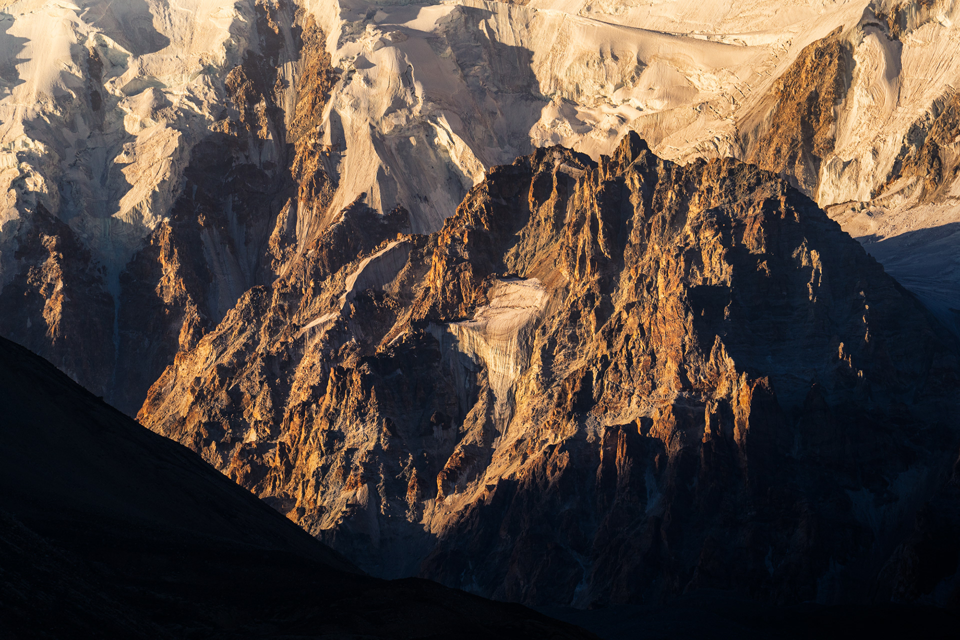 Sunrise on the jagged peaks of the Shakhdara Mountains, Tajik National Park, Pamir, Tajikistan