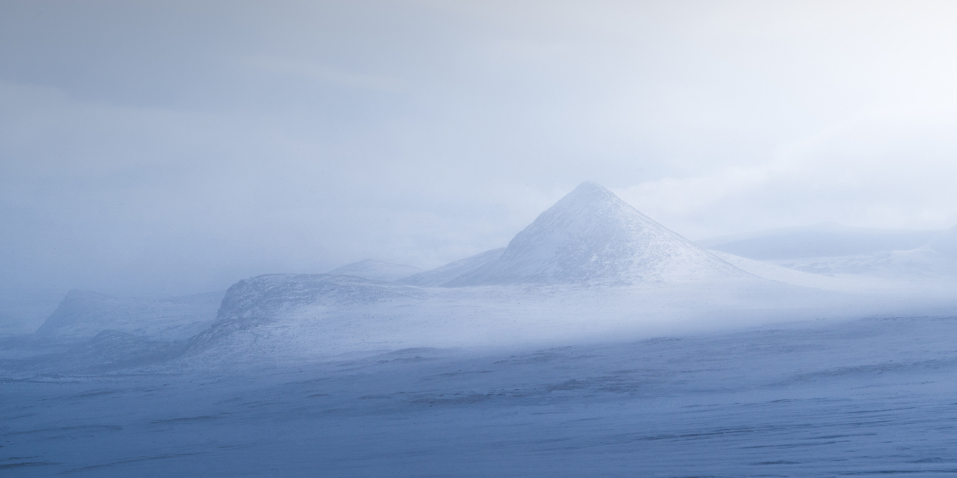Slugga Mountain in a hazy winter landscape scene, Swedish Arctic, Sarek / Suorva / Storja Sjofallet / Laponia