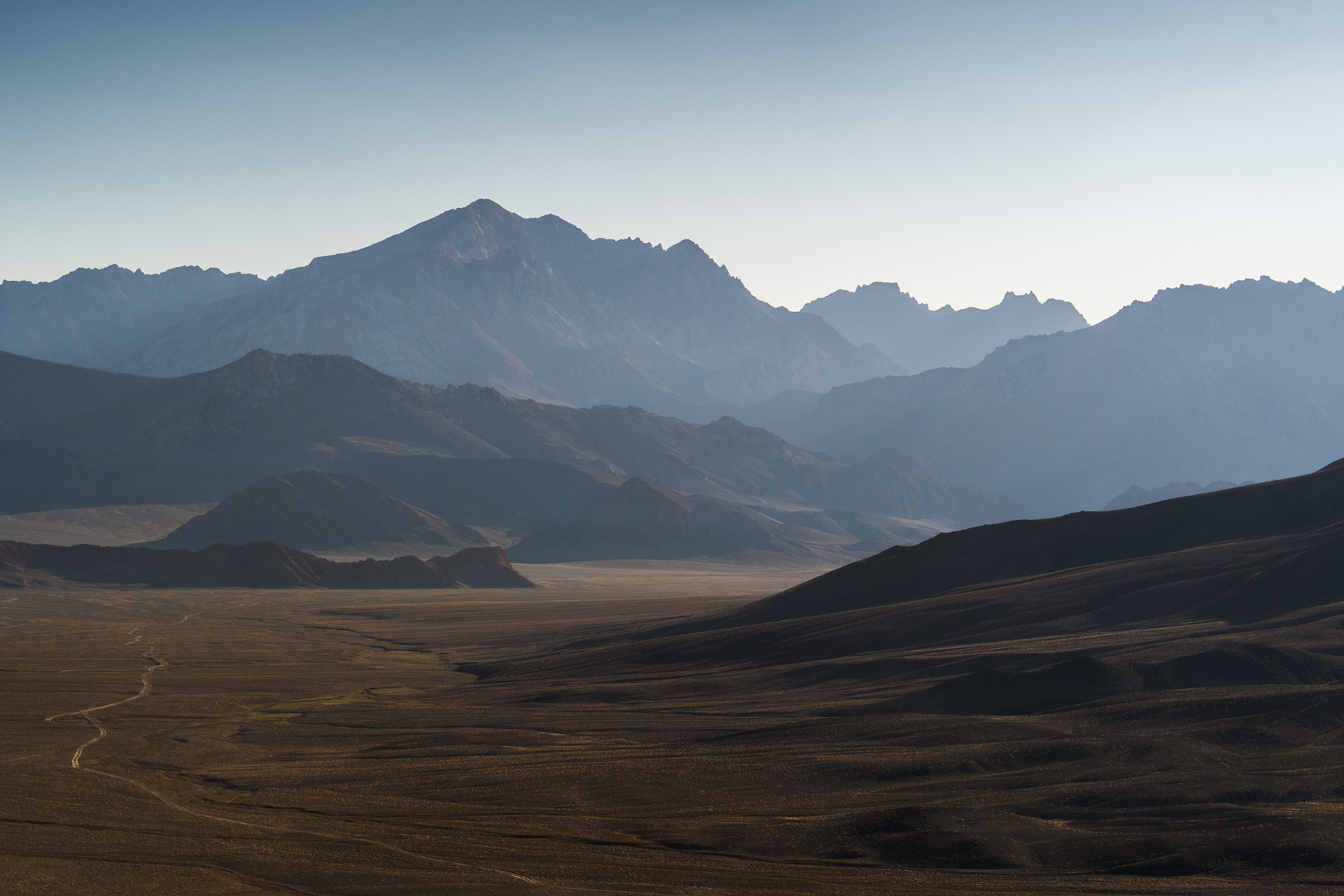 Jagged mountains in a hazy light in Tajikistan