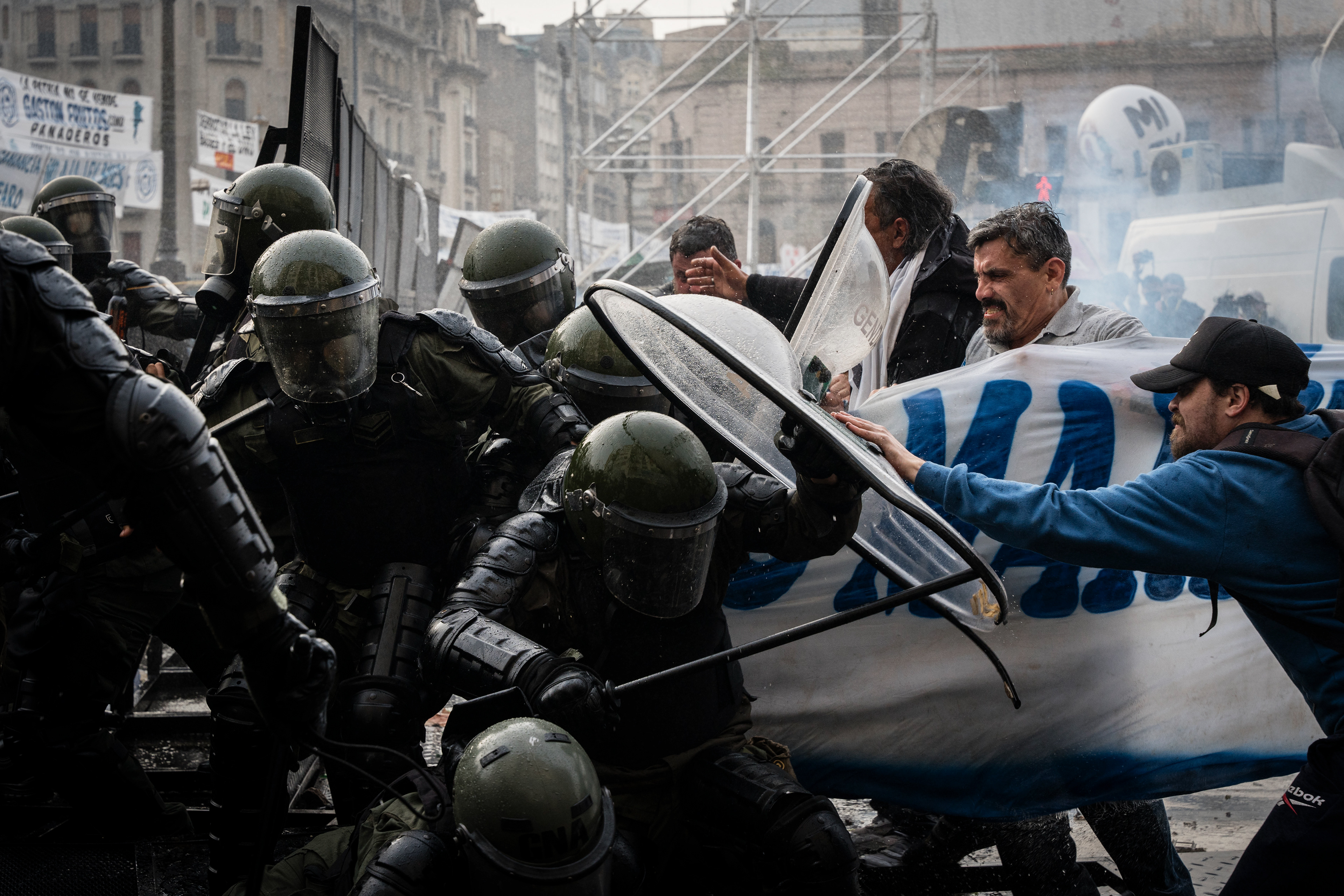 National Gendarmerie forces confront the protesters as they protest outside while the Senate debates Javier Milei's Ley Bases. The Senate Chamber of the Argentine Congress is debating Javier Milei's Ley Bases, which has already passed the Chamber of Deputies. Meanwhile, hundreds of thousands of demonstrators are protesting in the streets, leading to confrontations and repressive actions by security forces, in Buenos Aires, Argentina, on June 12, 2024. PHOTO: Santiago Oroz