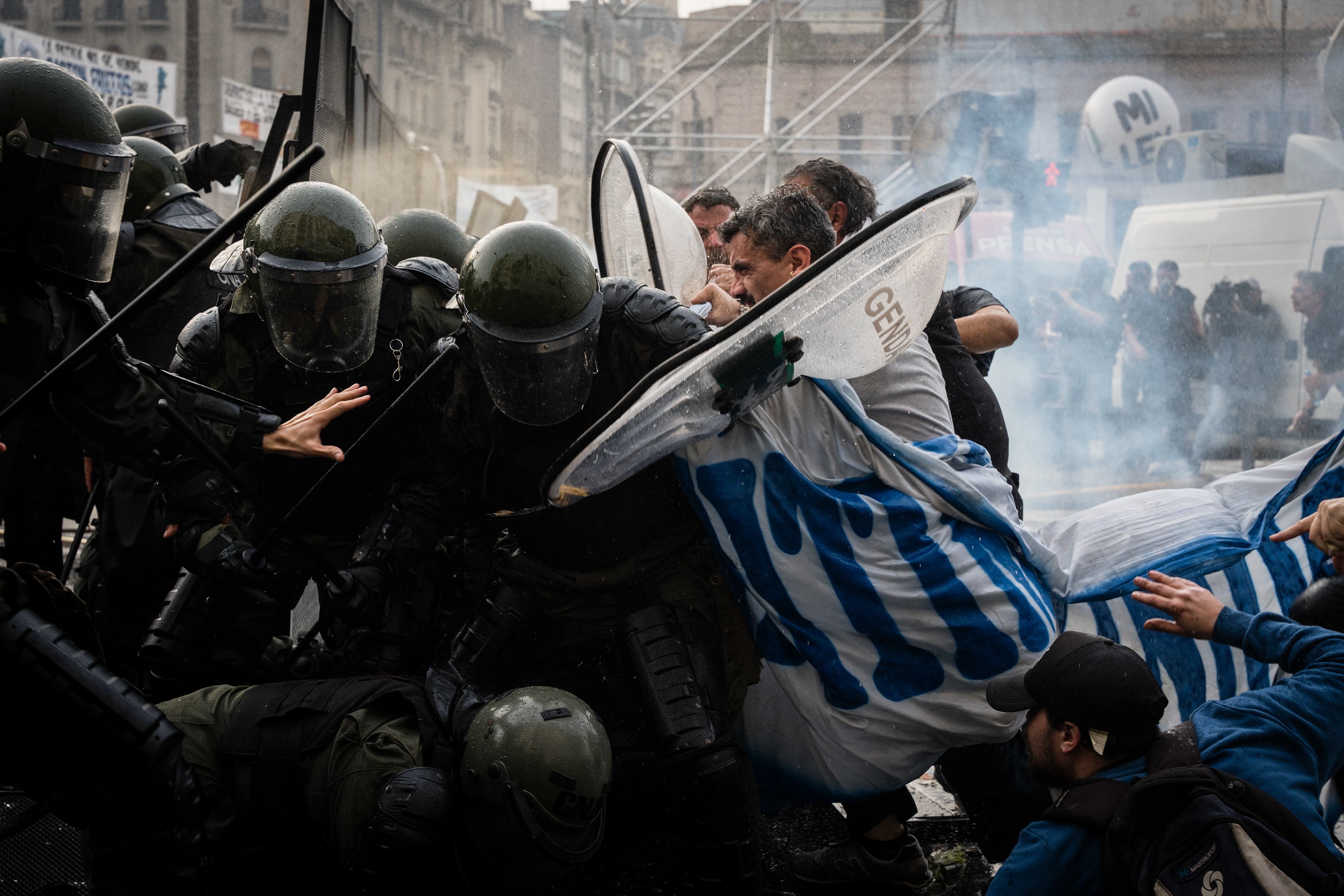 National Gendarmerie forces confront the protesters as they protest outside while the Senate debates Javier Milei's Ley Bases. The Senate Chamber of the Argentine Congress is debating Javier Milei's Ley Bases, which has already passed the Chamber of Deputies. Meanwhile, hundreds of thousands of demonstrators are protesting in the streets, leading to confrontations and repressive actions by security forces, in Buenos Aires, Argentina, on June 12, 2024. PHOTO: Santiago Oroz