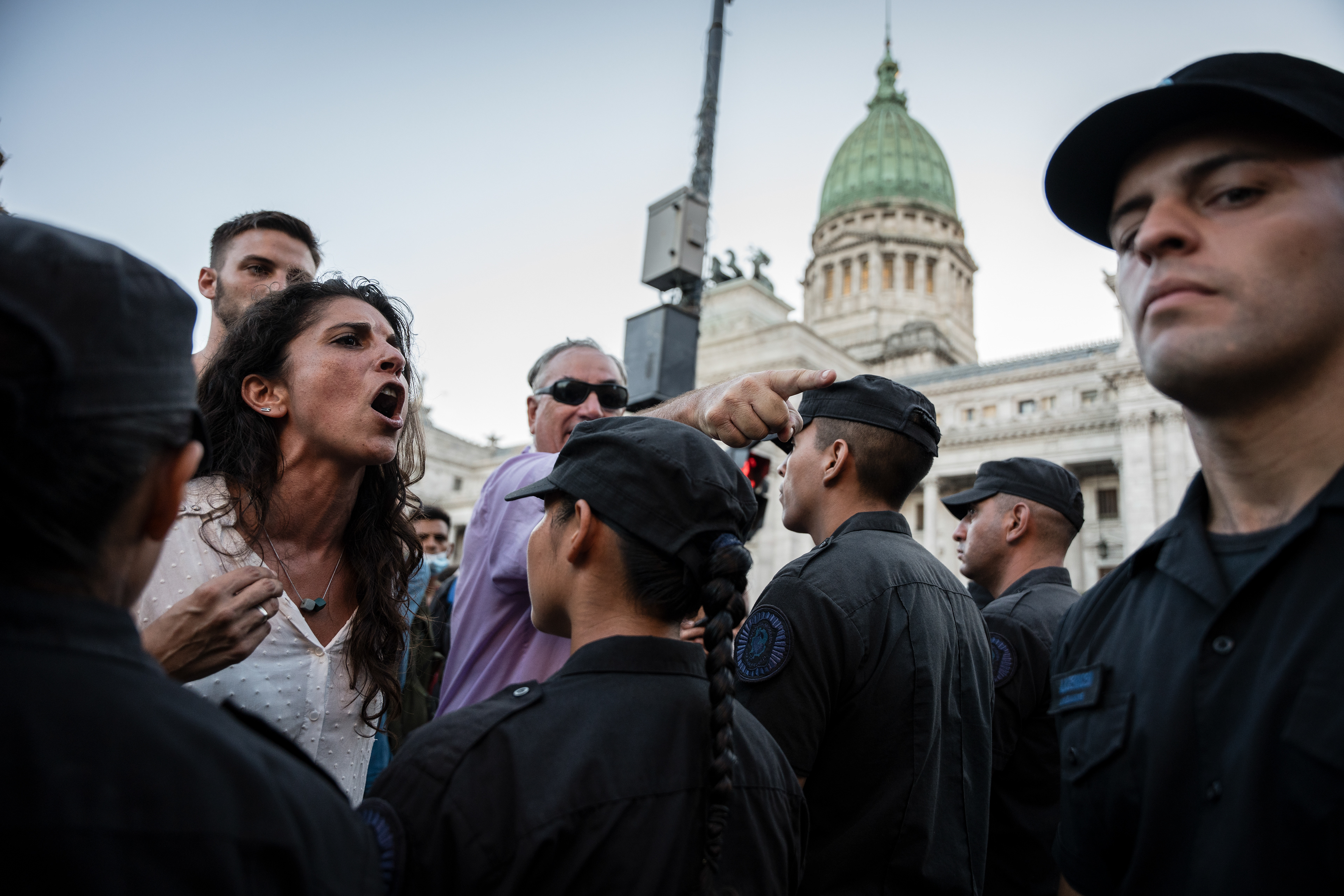 Leftist legislator Celeste Fierro argues with police, as the third day of debate takes place in the National Congress of the treatment of President Javier Milei's "Omnibus Law", in Buenos Aires, Argentina, February 2, 2024. PHOTO: Santiago Oroz.