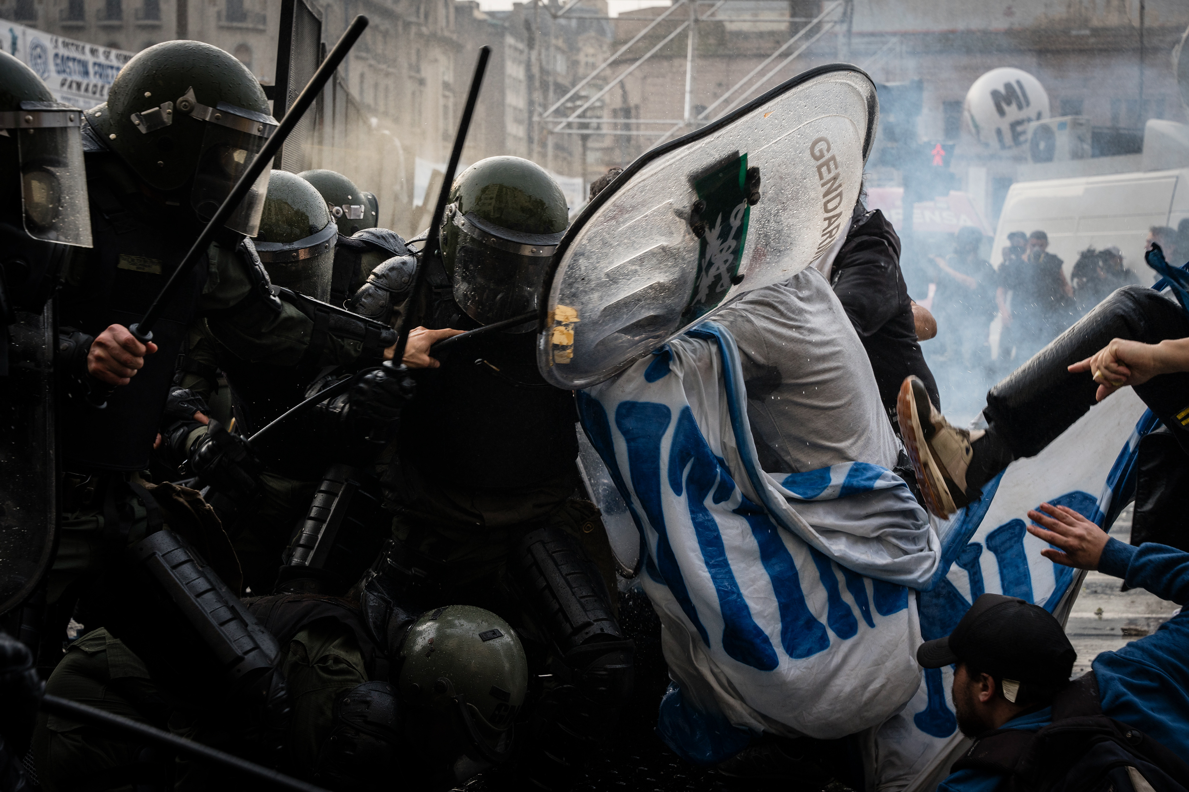 National Gendarmerie forces confront the protesters as they protest outside while the Senate debates Javier Milei's Ley Bases. The Senate Chamber of the Argentine Congress is debating Javier Milei's Ley Bases, which has already passed the Chamber of Deputies. Meanwhile, hundreds of thousands of demonstrators are protesting in the streets, leading to confrontations and repressive actions by security forces, in Buenos Aires, Argentina, on June 12, 2024. PHOTO: Santiago Oroz