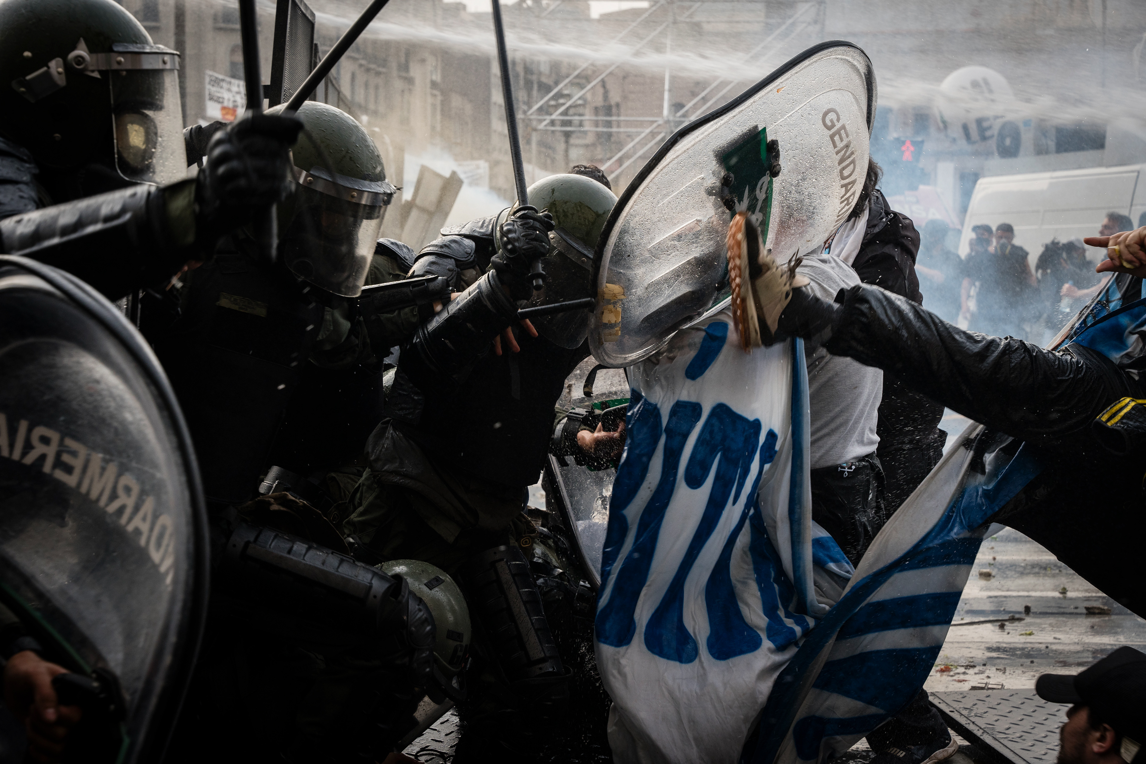 National Gendarmerie forces confront the protesters as they protest outside while the Senate debates Javier Milei's Ley Bases. The Senate Chamber of the Argentine Congress is debating Javier Milei's Ley Bases, which has already passed the Chamber of Deputies. Meanwhile, hundreds of thousands of demonstrators are protesting in the streets, leading to confrontations and repressive actions by security forces, in Buenos Aires, Argentina, on June 12, 2024. PHOTO: Santiago Oroz