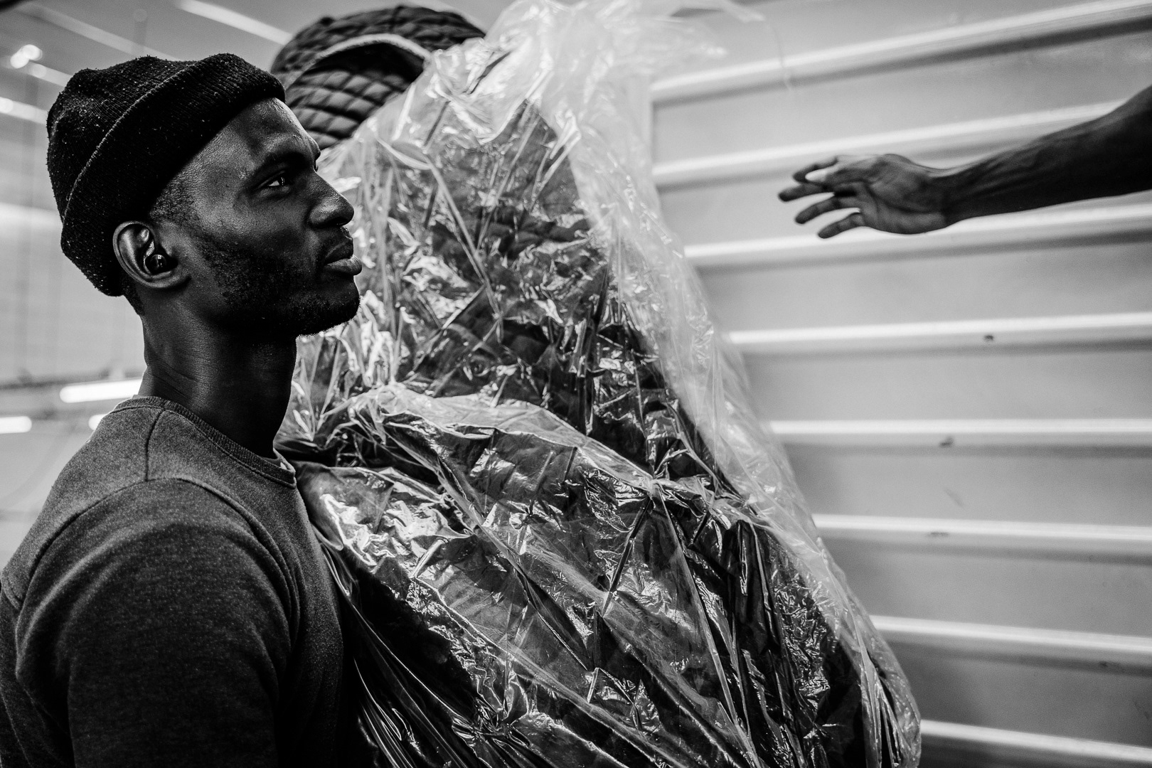 At the intersection of "Nueva York" and "Marsella" streets in the town of Berisso there is a sign that says that this corner is "kilometer 0" of Peronism. From there, where the Swift meat packing plant operated decades ago, the columns of October 17, 1945, marched to Plaza de Mayo to demand Perón's release. Today, this industrial area next to the port, abandoned for years, is once again being recovered by the workers' movement, now in the form of its new emergent, the "popular economy". The textile cooperatives of seamstresses and seamstresses of Argüello and Unión move their textile poles to the fourth floor of that old and worn-out building that saw the birth of Peronism as a movement and is reborn as a productive space, with the workers on the margins, informal, fighting for the most basic rights, escaping from clandestinity. In Buenos Aires, Argentina, on June 2, 2023. PHOTO/Santi Oroz.