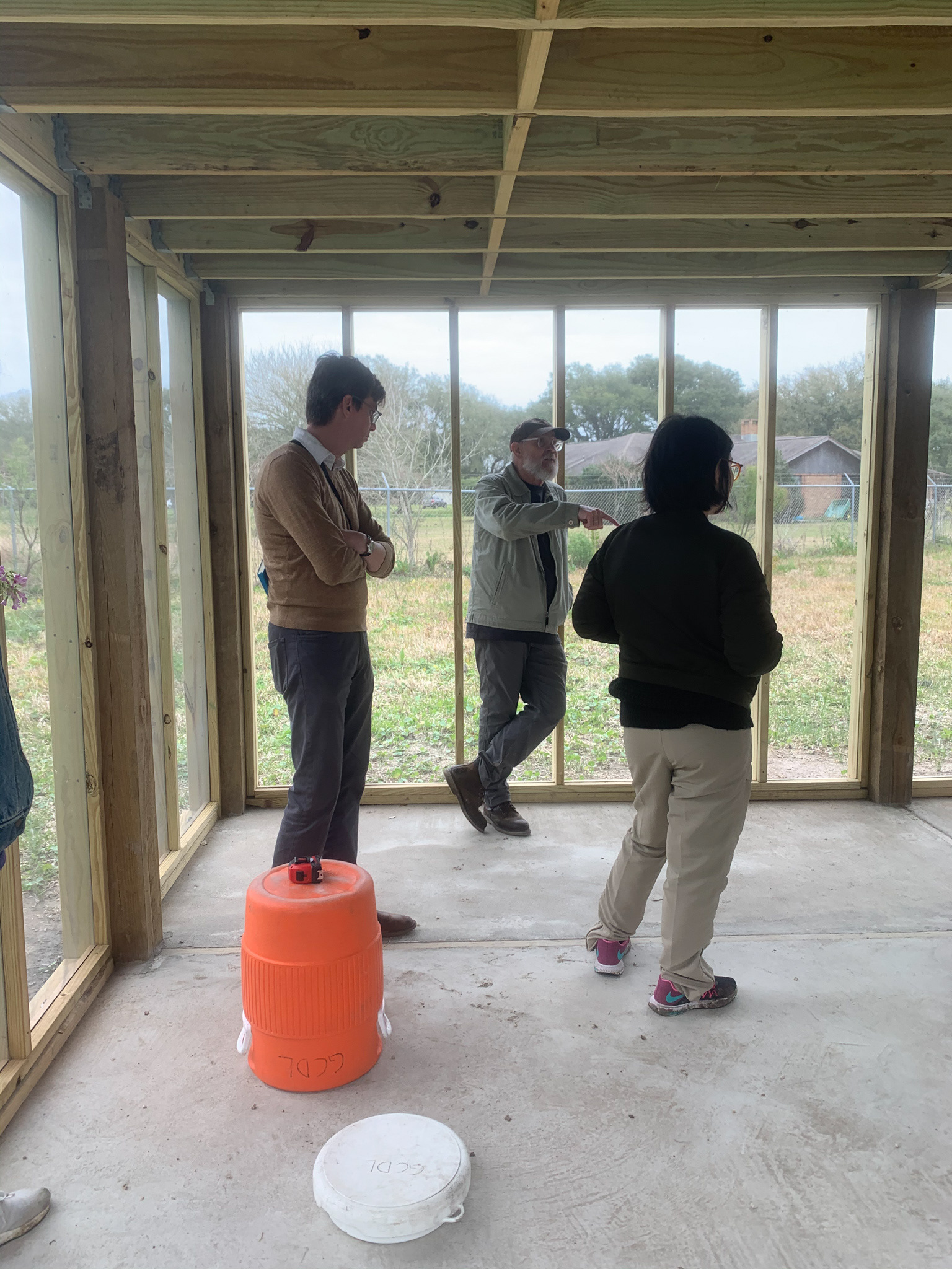 Discussing what furniture we could build that would best fit in the space.