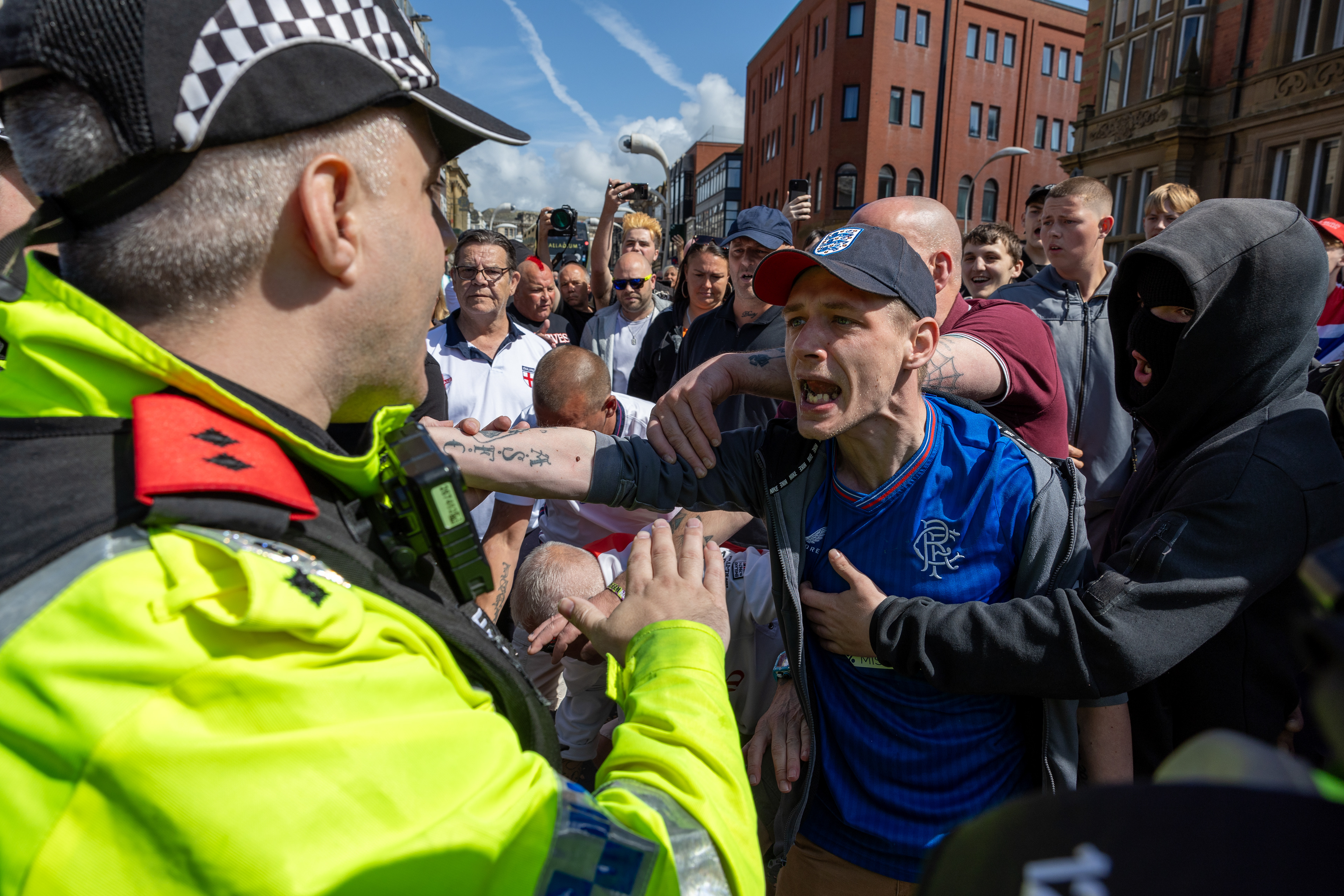 Protesters in Blackpool town centre on Saturday August 3 2024, before proceedings descended into violent skirmishes. Daniel Stewart, in the blue Rangers football shirt, was later jailed for his part in the disorder