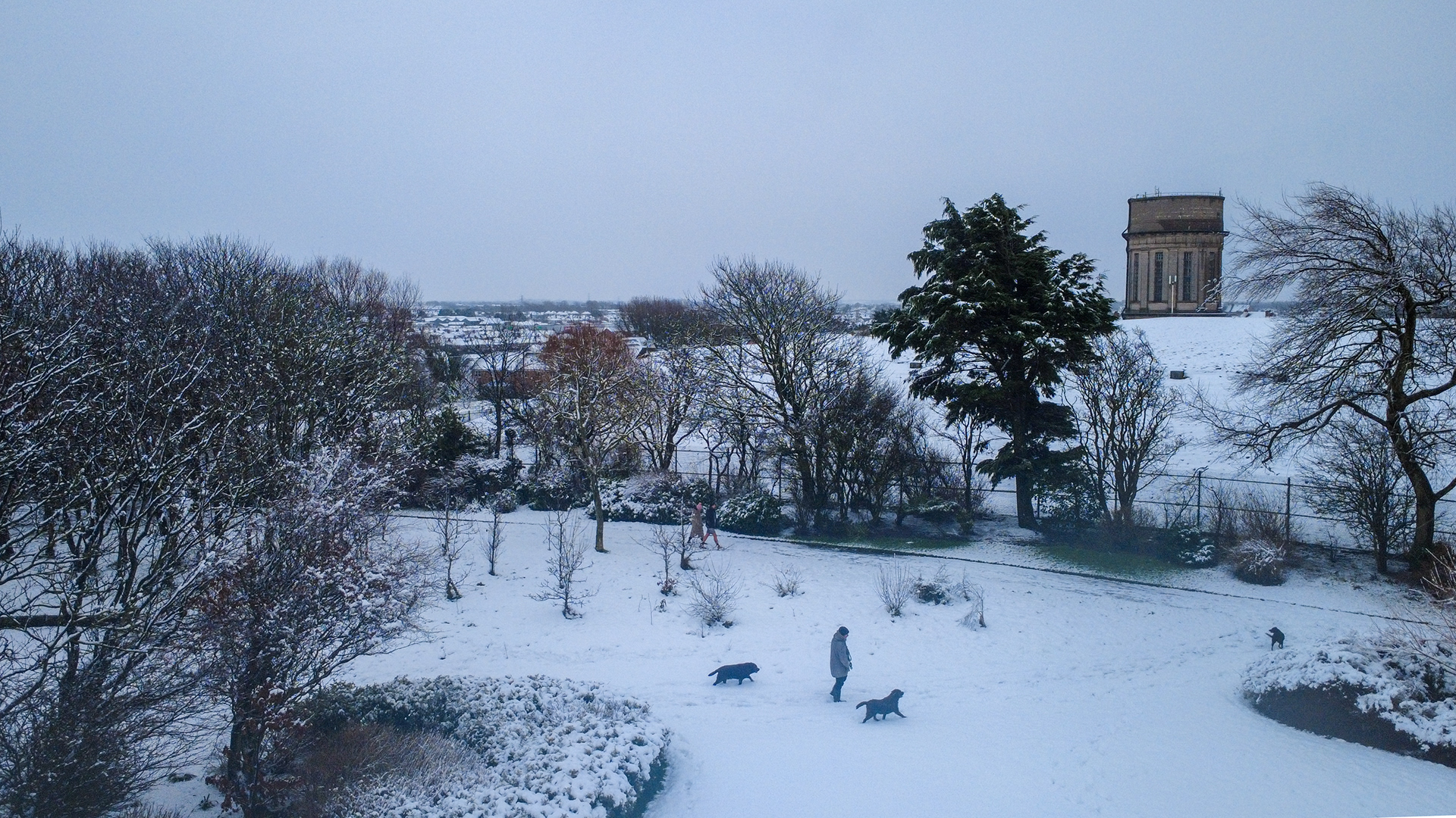 A blanket of snow covers the Rock Gardens in Blackpool's North Shore, with the Warbreck water town in the background, on Sunday January 5 2025.
