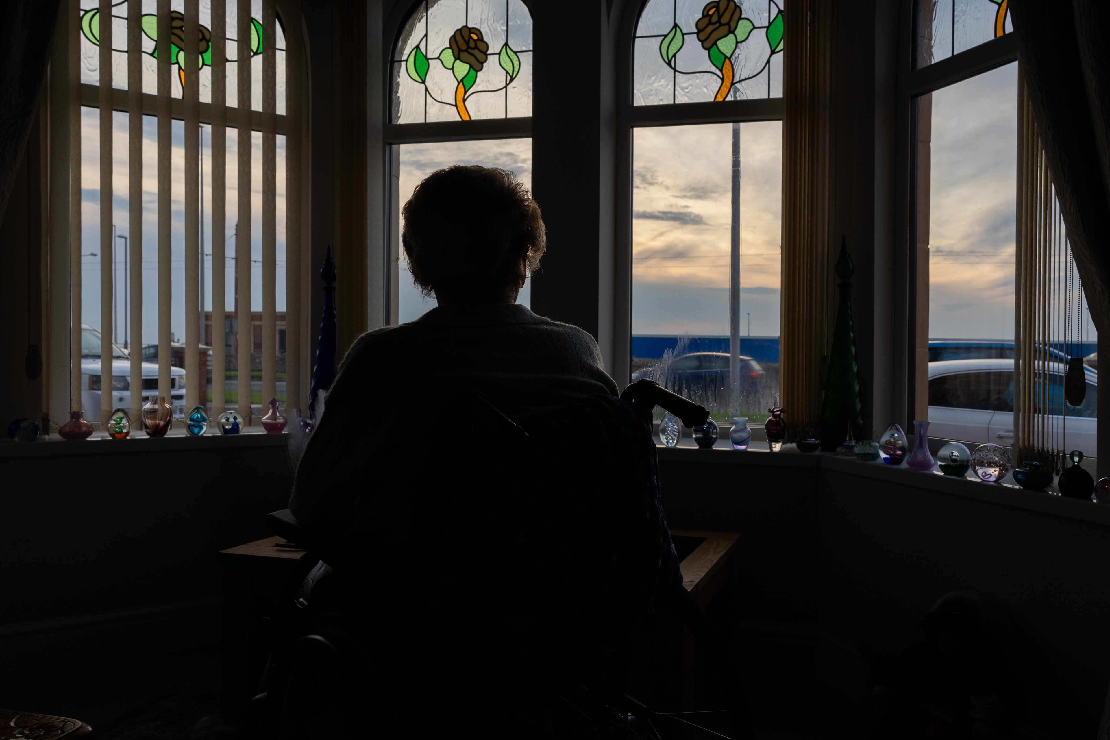 Doreen Jackson looks out of her Promenade home at blue hoardings that have been blocking her view of the beach for years. The 86-year-old, who has one leg and uses a wheelchair, fears she will die before she gets to see the sea from her ground floor flat