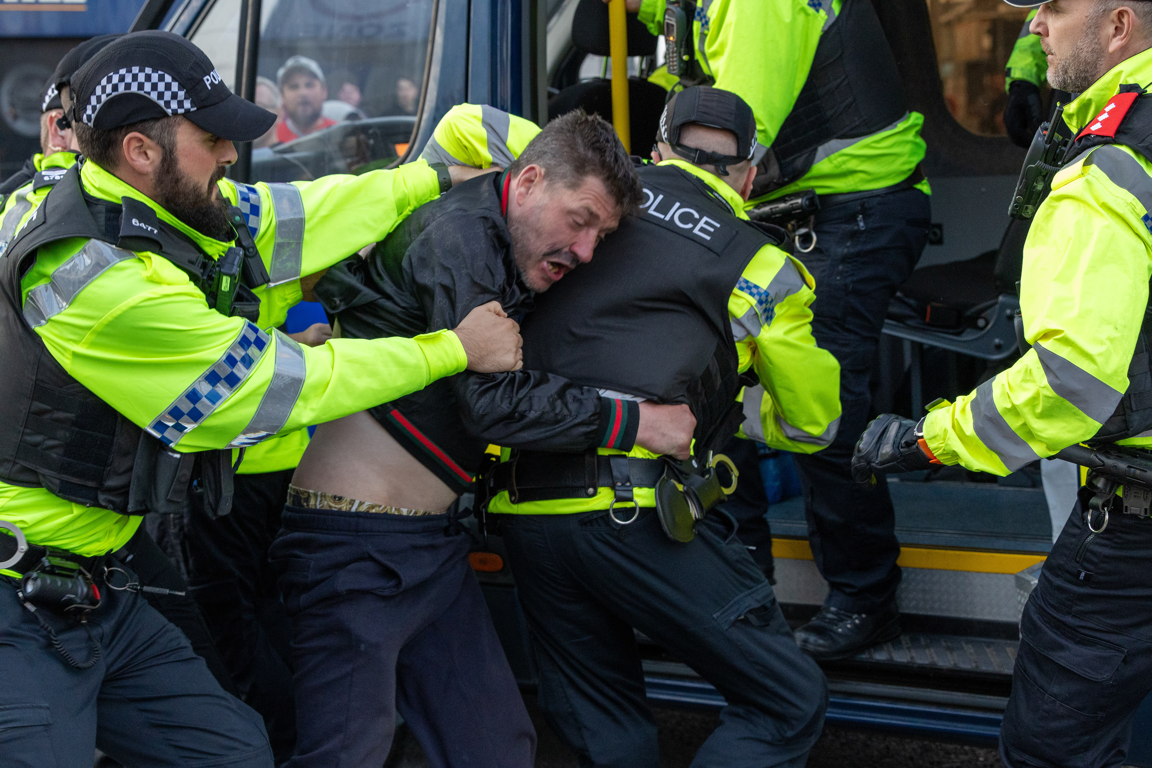 Police officers detain a man during an anti-immigration protest in Blackpool on Wednesday August 7 2024