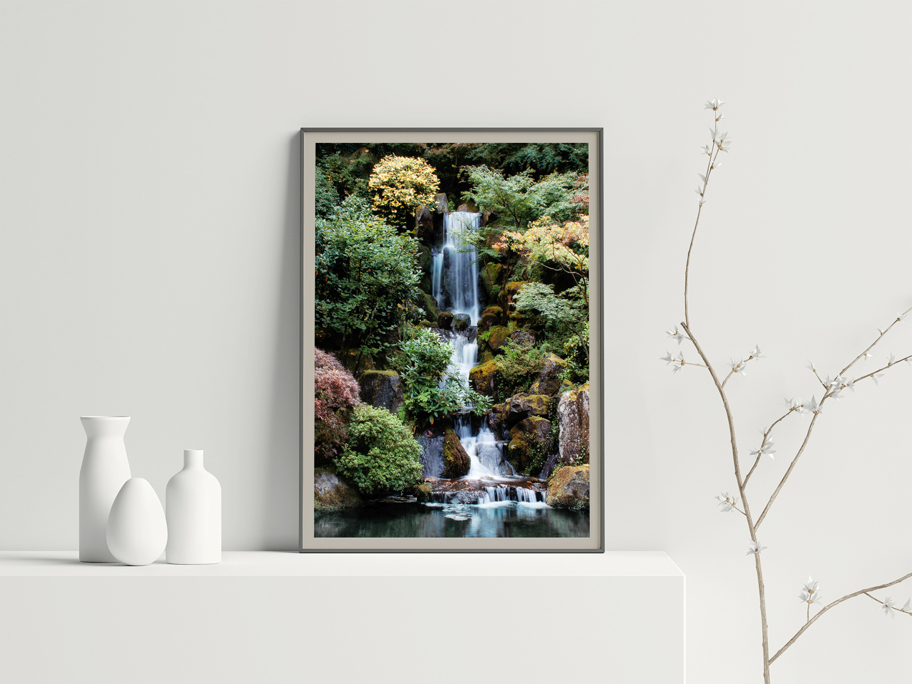 Modern Interior with white vases, branch and shelf with fine art photographic print "Heavenly Falls" of a waterfall surrounded by fall colors by Ann Whitted of Four Leaf Photography