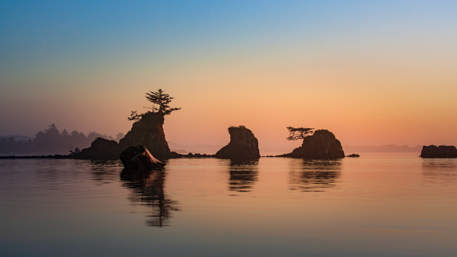 Still..Last light as the sun sets on still waters on the Pacific...Oregon Coast
