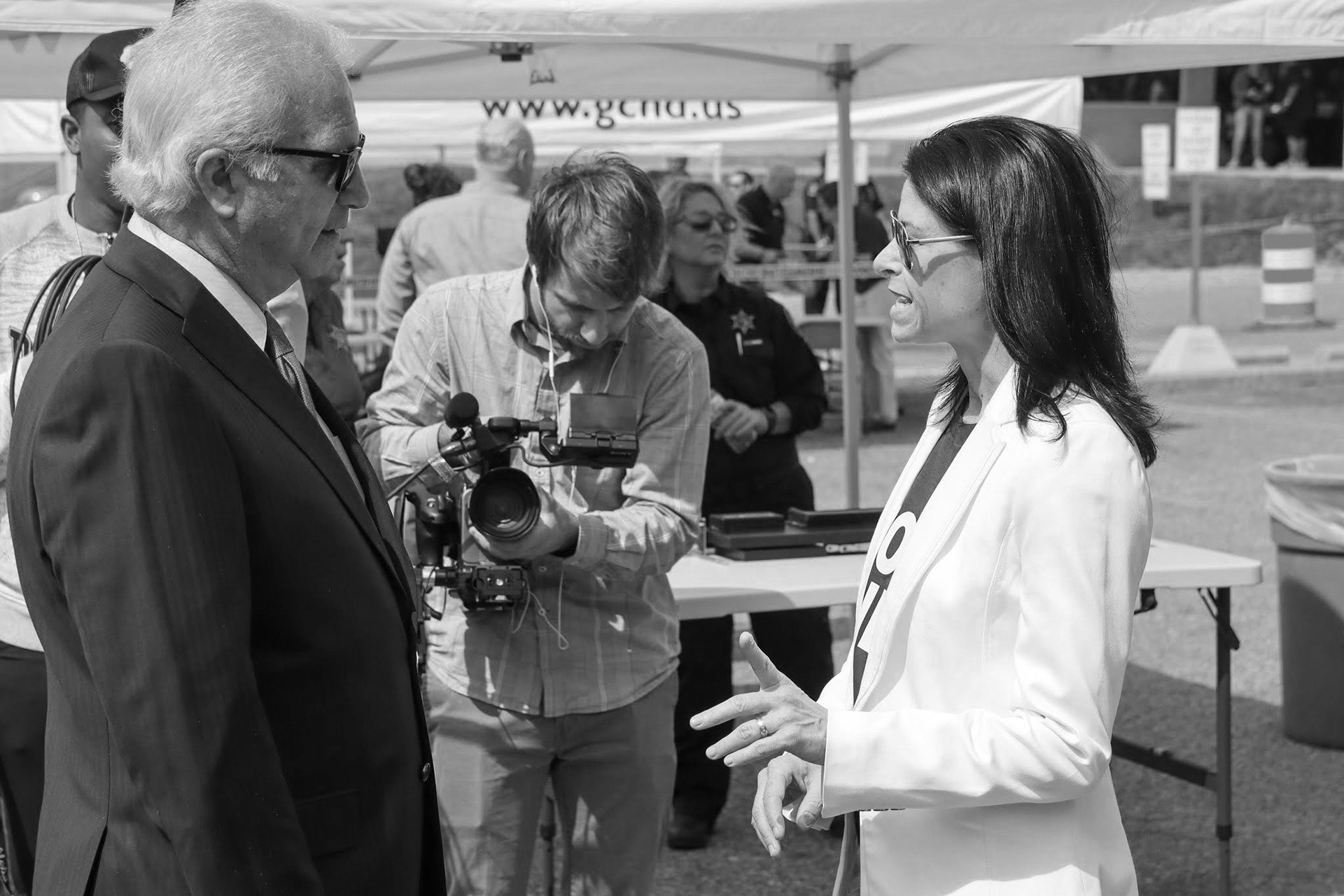 Capturing b-roll of Michigan Attorney General Dana Nessel at an "expungement fair" in Flint, MI. Photo by Tina Miller. (2021)