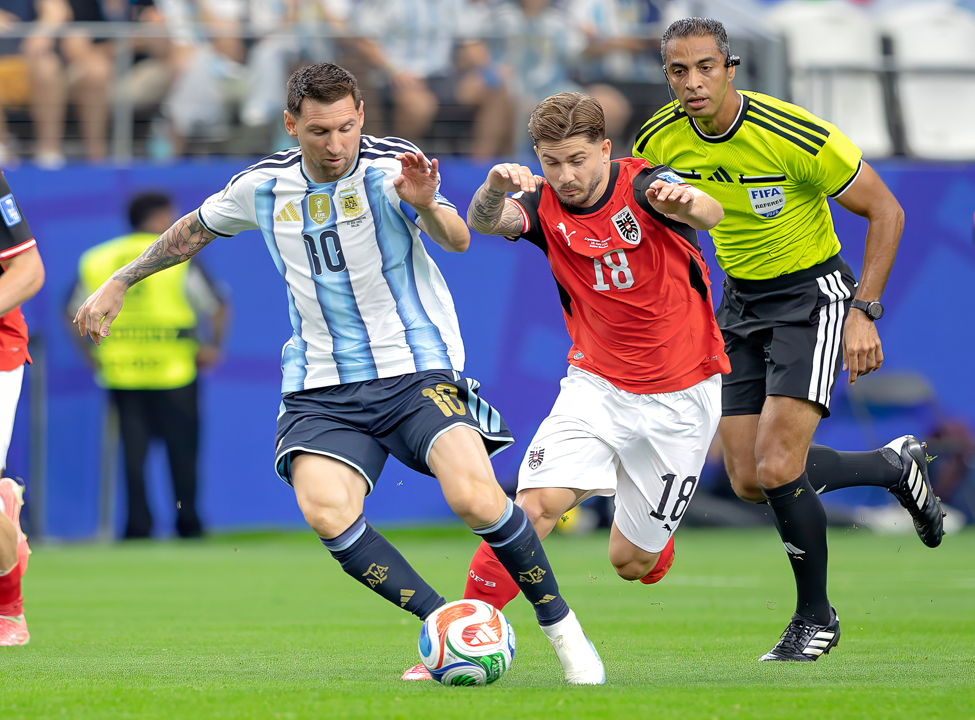 Messi dribbling down the pitch. 