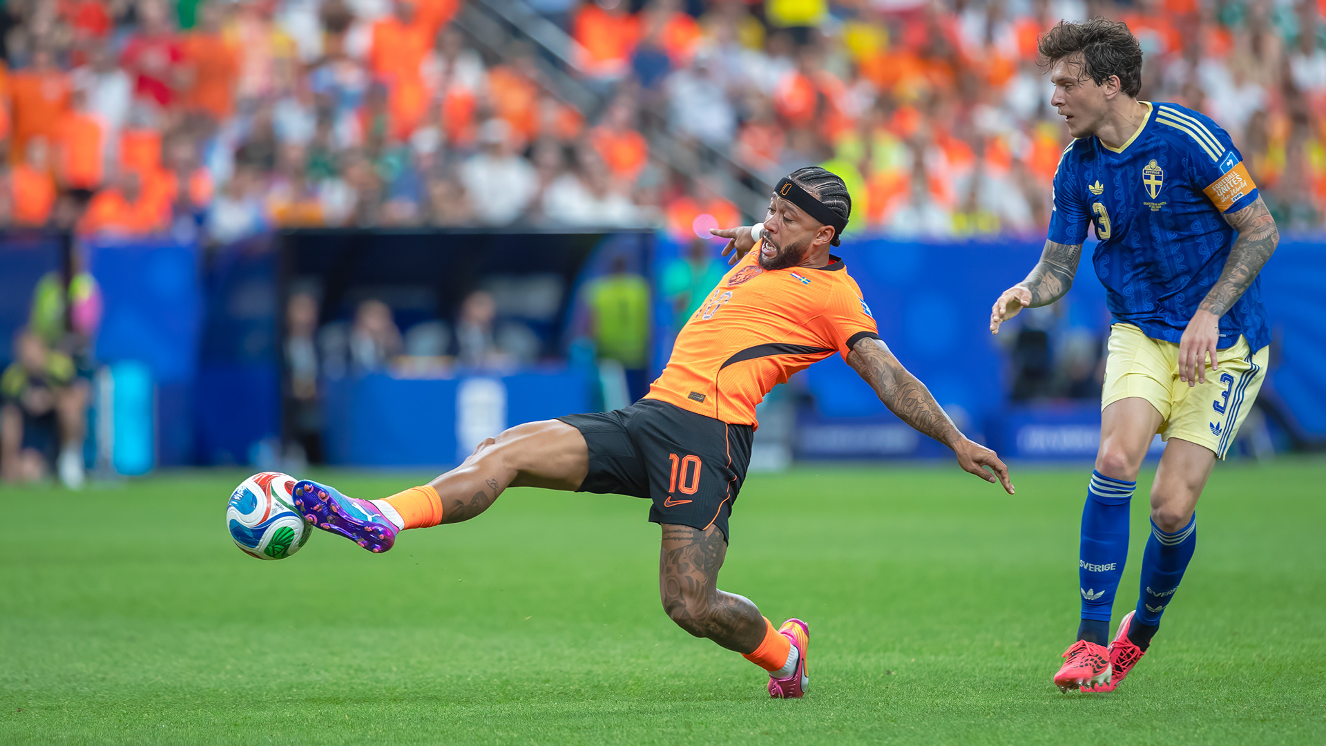 Netherland forward Memphis Depay stretches out to make contact with the ball