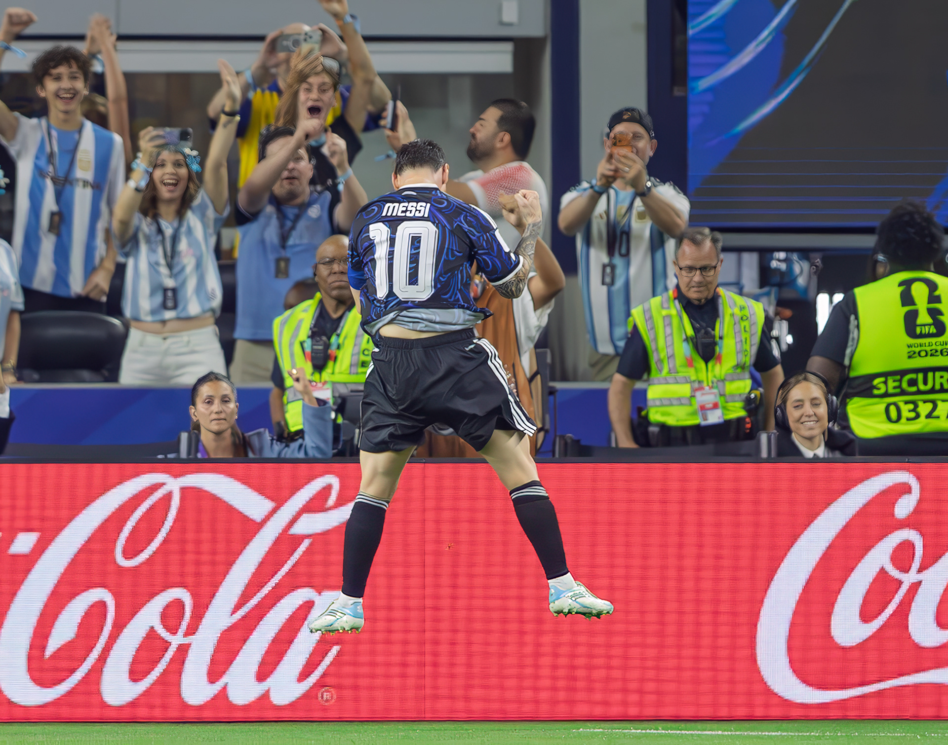 Lionel Messi of Argentina leaps in celebration after scoring from the penalty spot against Jordan during a FIFA World Cup 2026 match at AT&T Stadium in Arlington, Texas.
