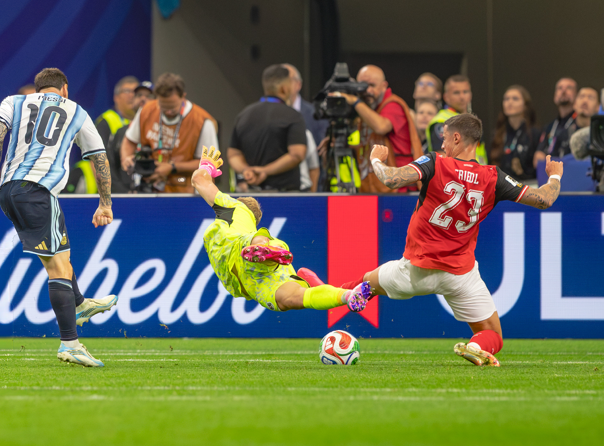 Lionel Messi threads the ball through multiple Austrian opponents to make his second goal of the match. 
